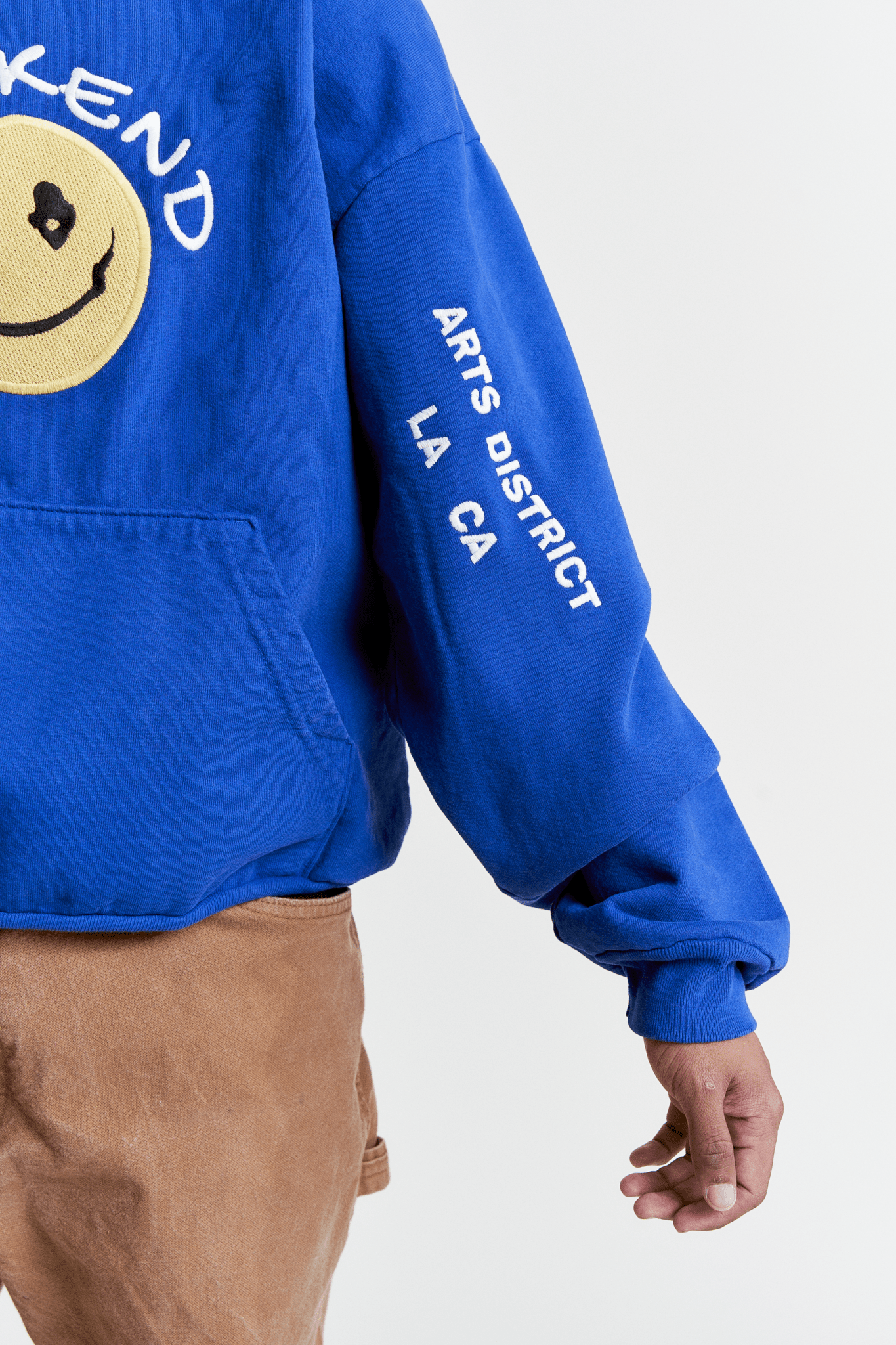 Happy Weekend Hoodie on male model - Arm Close Up Detail