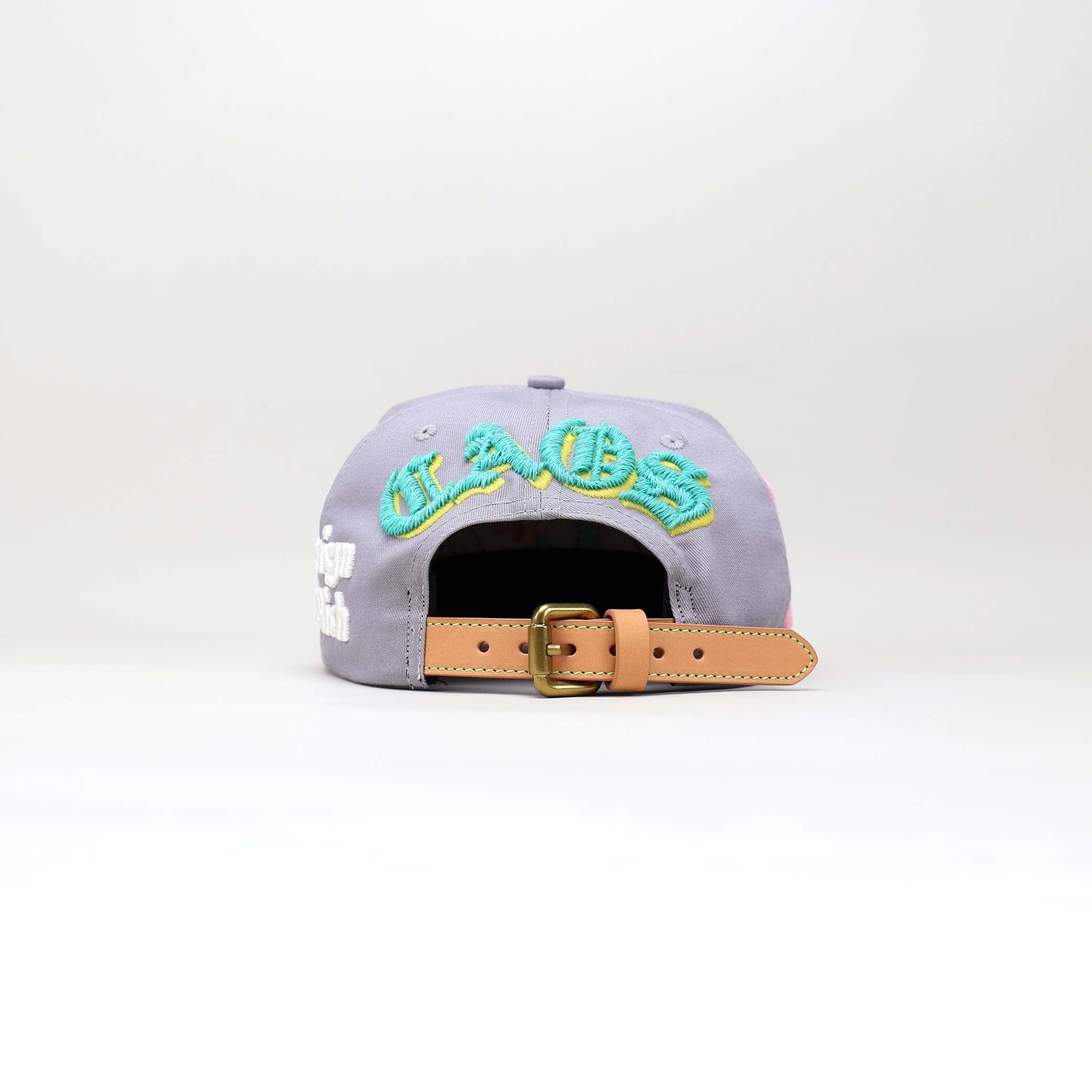 Gray cap, embroidered text, leather strap