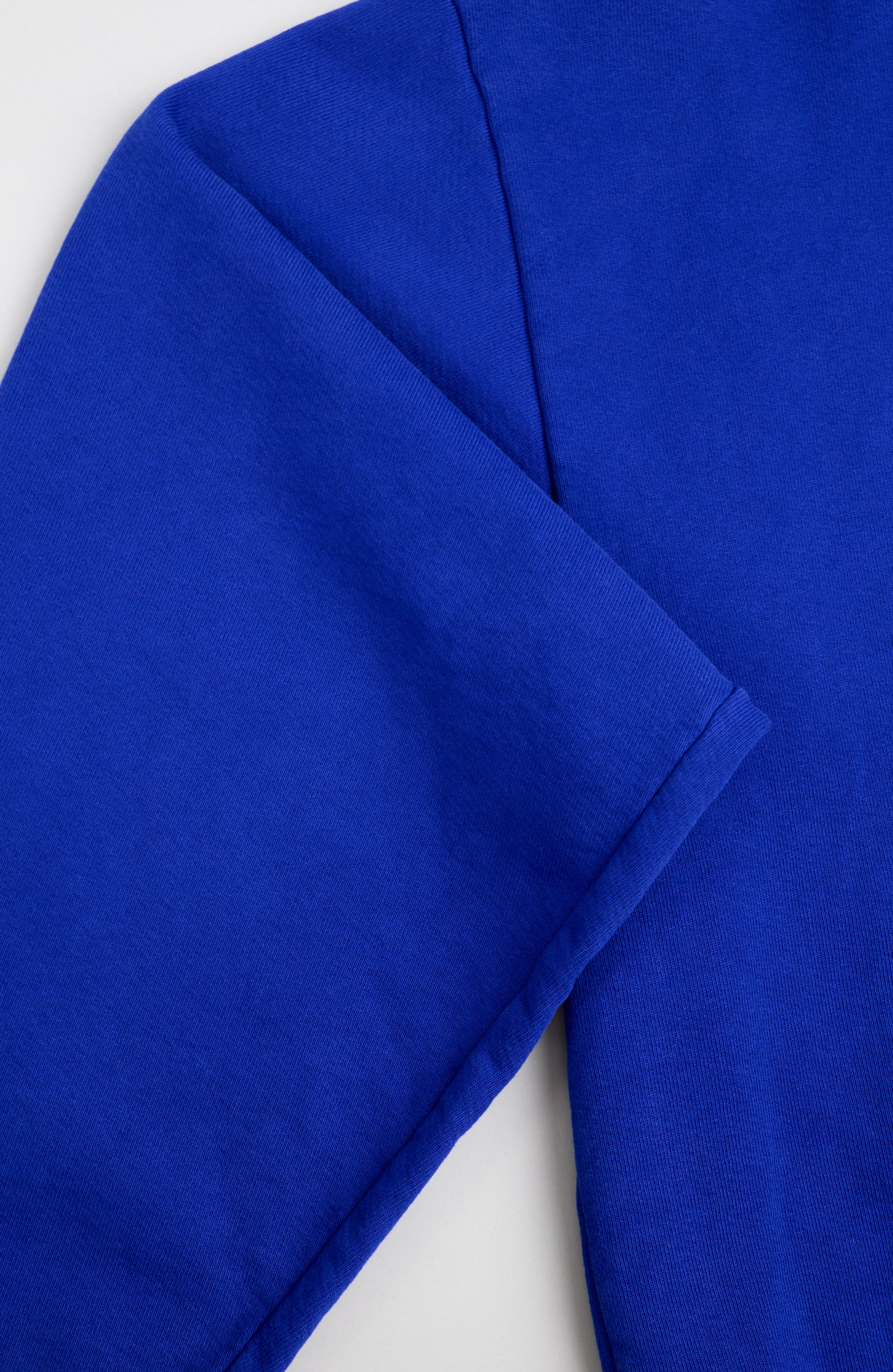 Blue fabric with a visible seam.