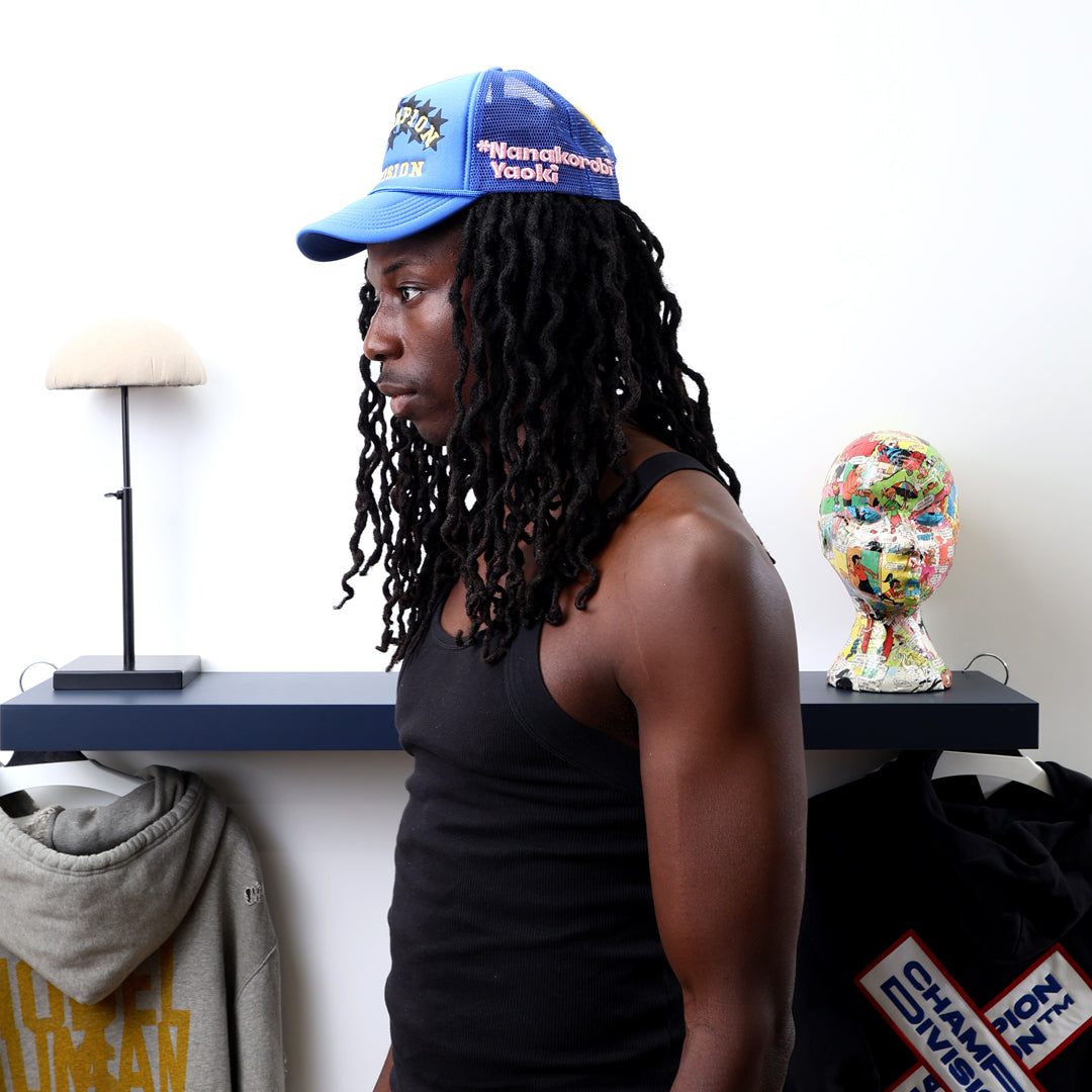 Fall 7 Rise 8 Blue Trucker Hat worn by male model -Side View