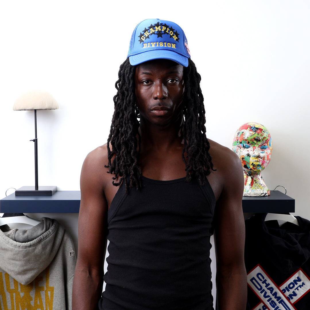 Fall 7 Rise 8 Blue Trucker Hat worn by male model -Front View