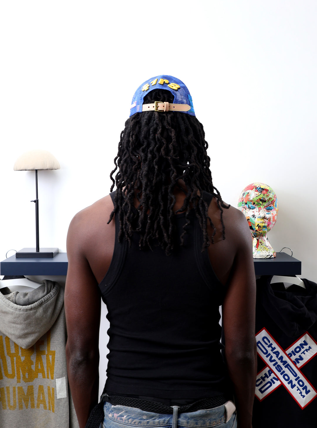 Fall 7 Rise 8 Blue Trucker Hat worn by male model -Back View