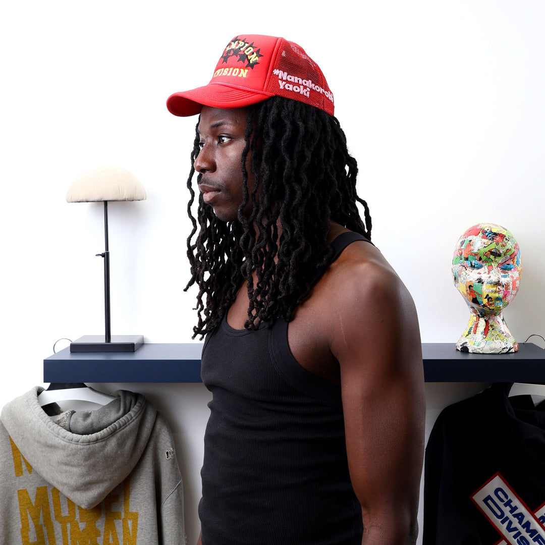 Fall 7 Rise 8 Red Trucker Hat worn by male model -Left View