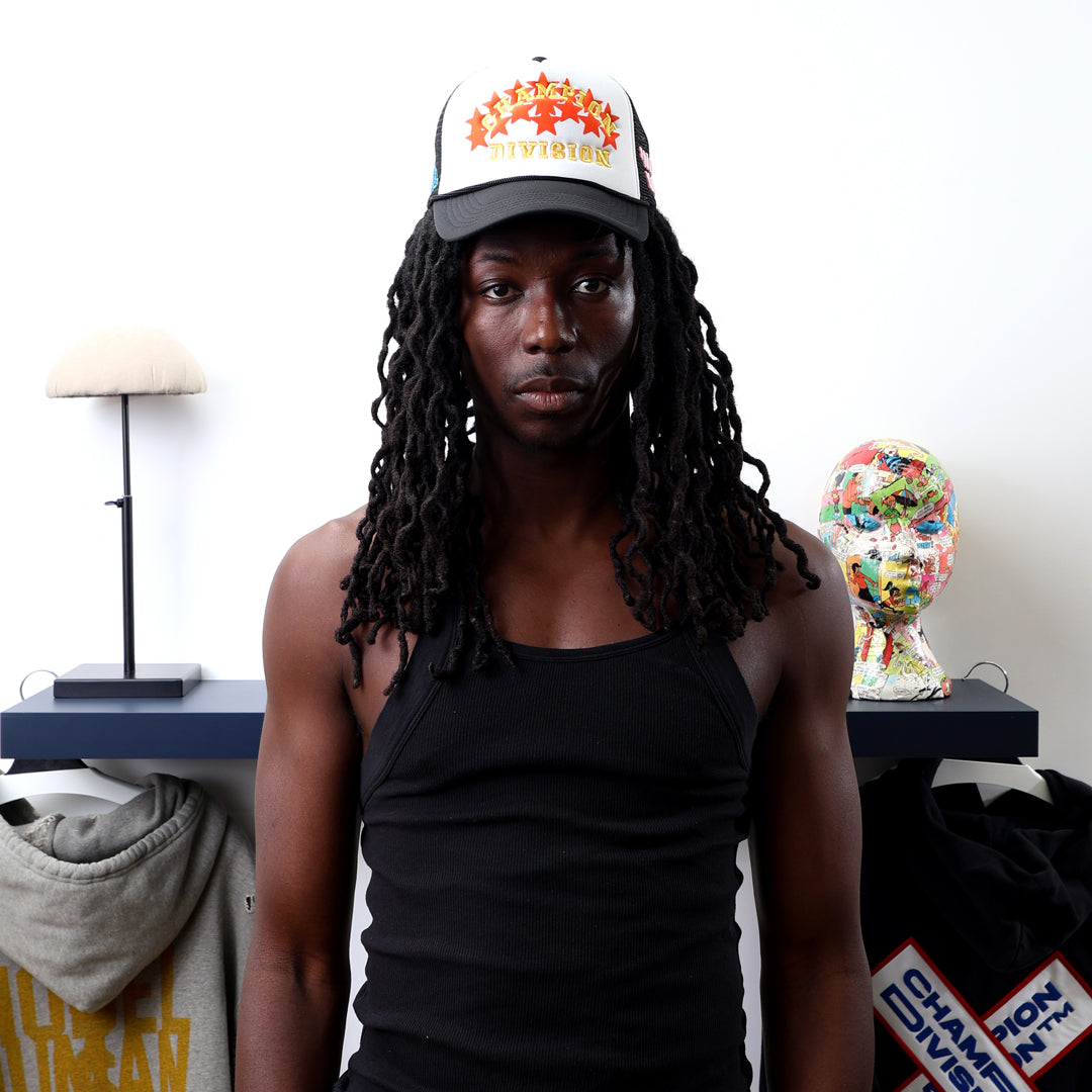 Fall 7 Rise 8 Black/White Trucker Hat worn by male model -Front View