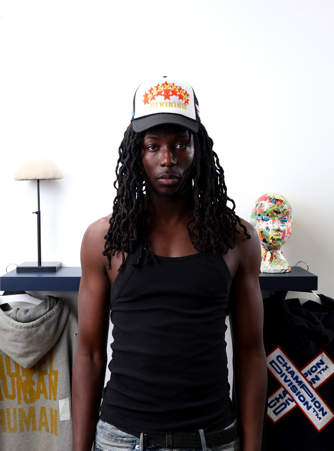 Fall 7 Rise 8 Black/White Trucker Hat worn by male model -Front View