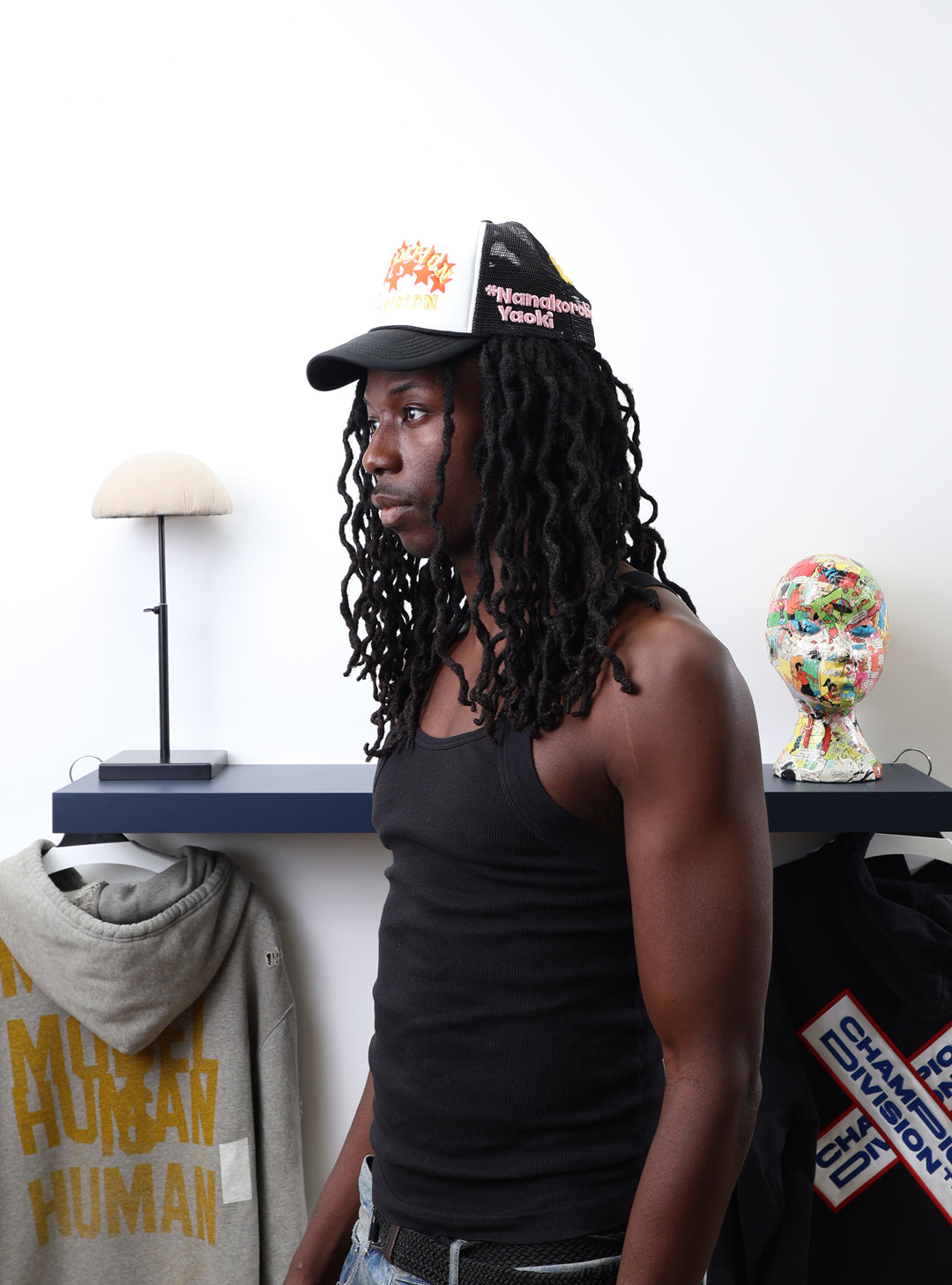 Fall 7 Rise 8 Black/White Trucker Hat worn by male model -Side View