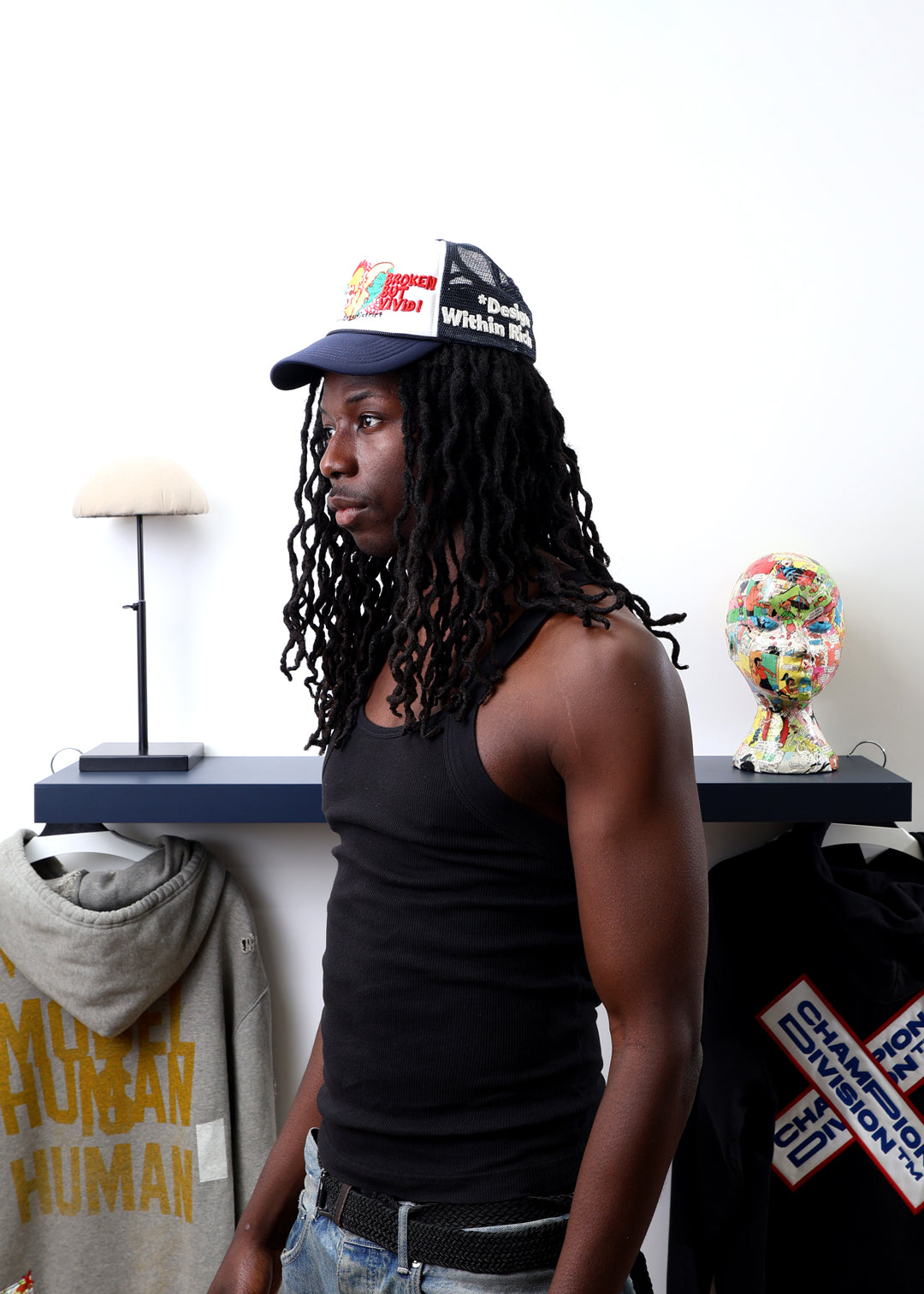 Person wearing a cap with a colorful design