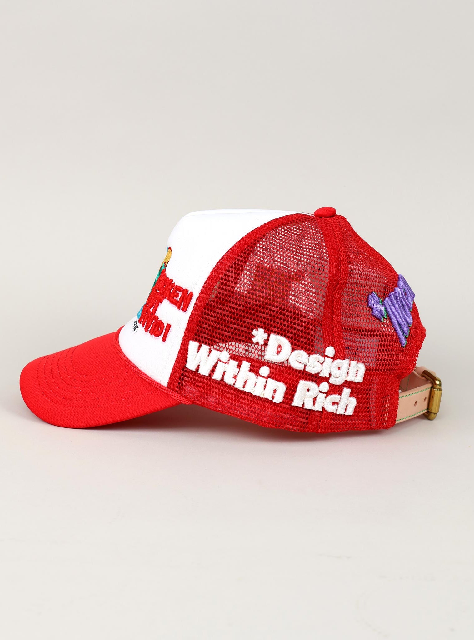 Red and white mesh cap with embroidered text.