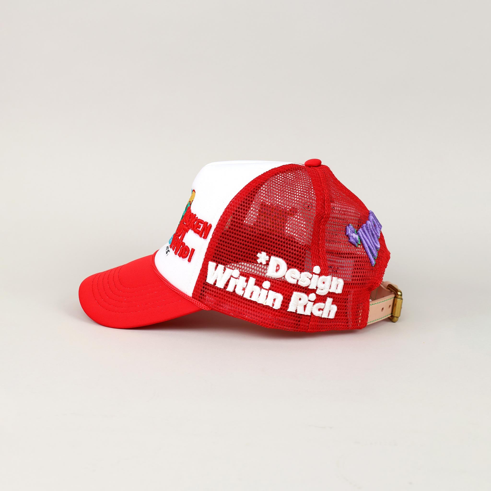 Red and white mesh cap with embroidered text.
