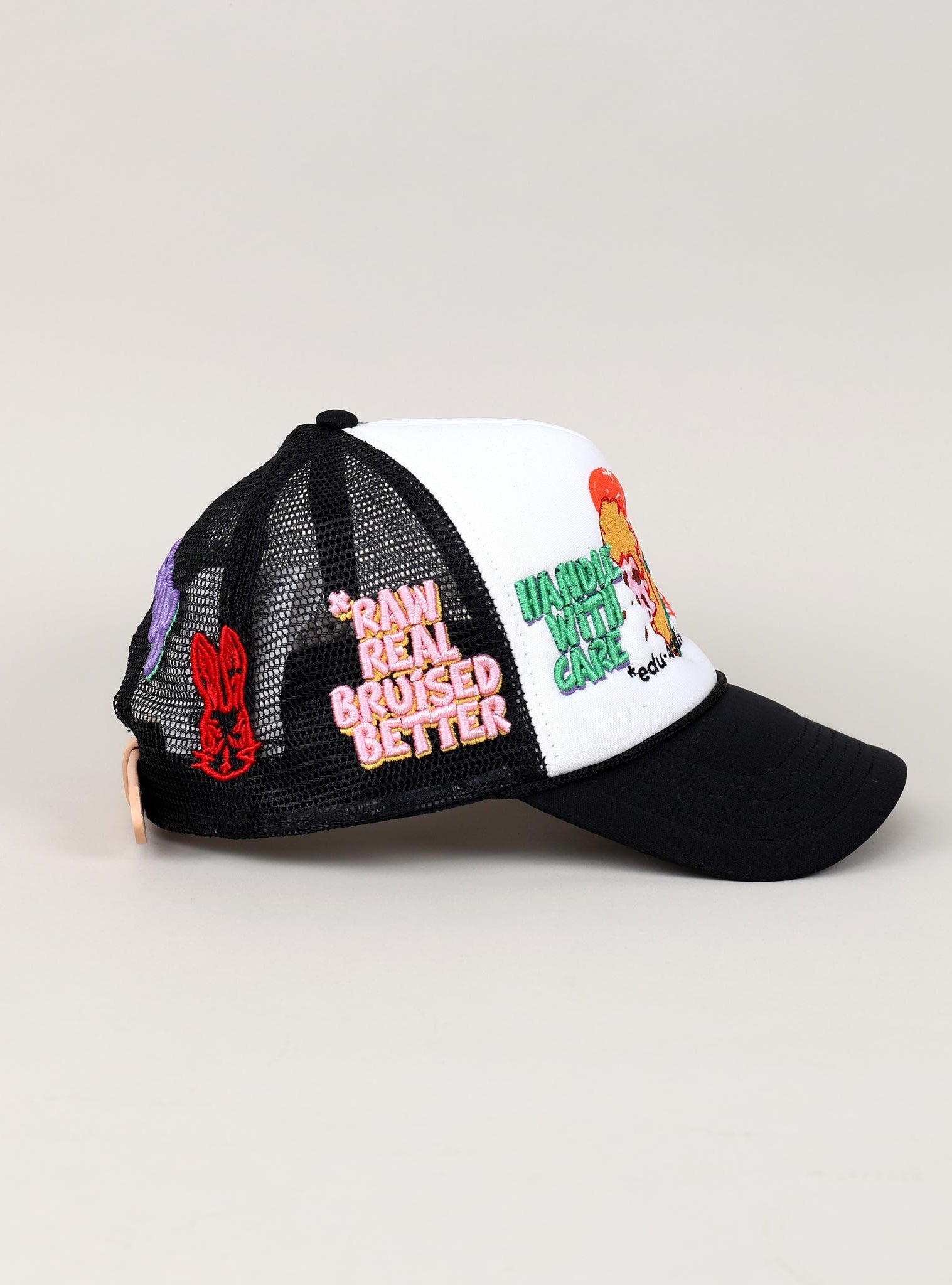 Black and white cap with embroidered patches.