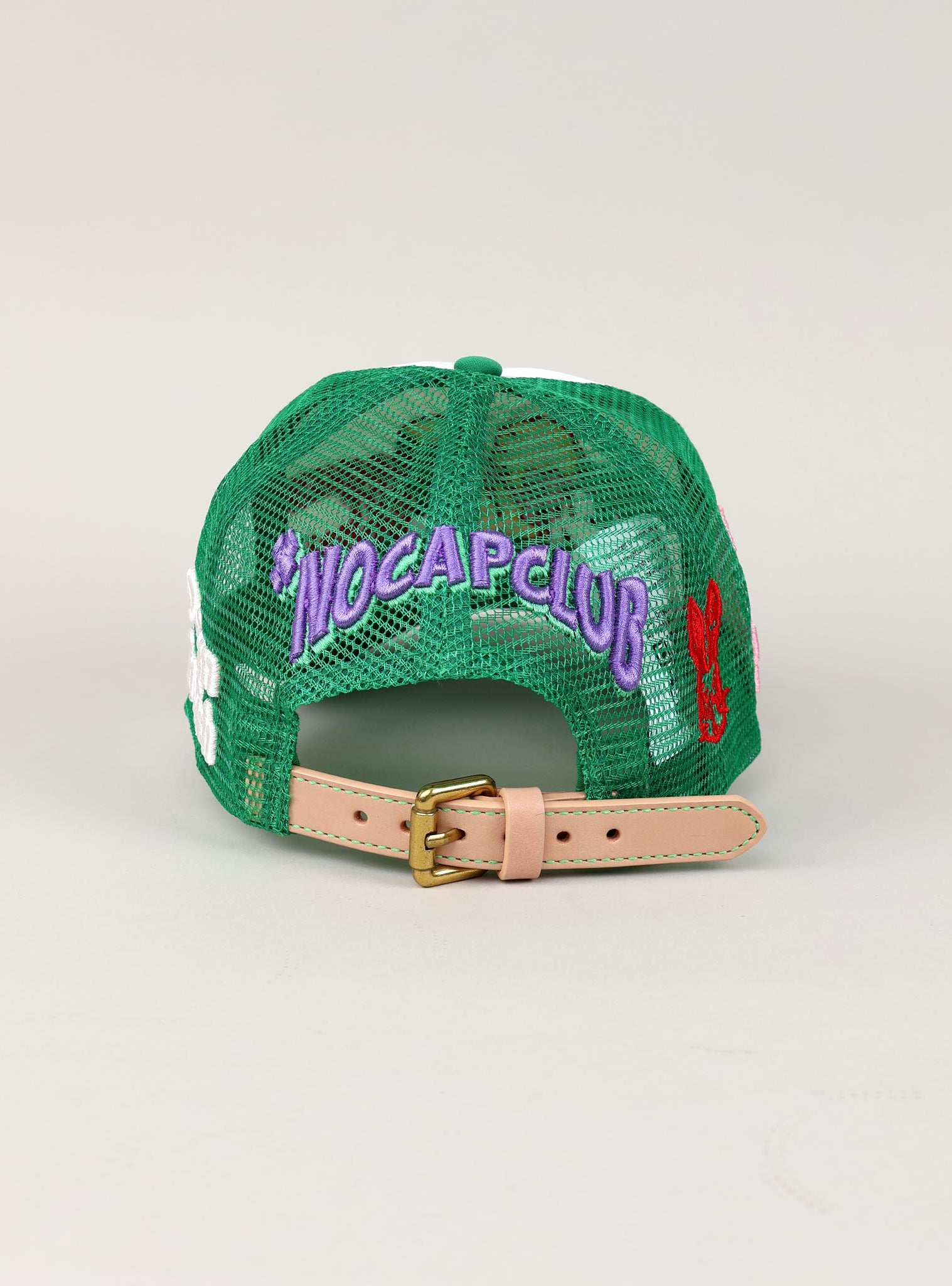 Green mesh cap with "NOCAPCLUB" text, adjustable strap.