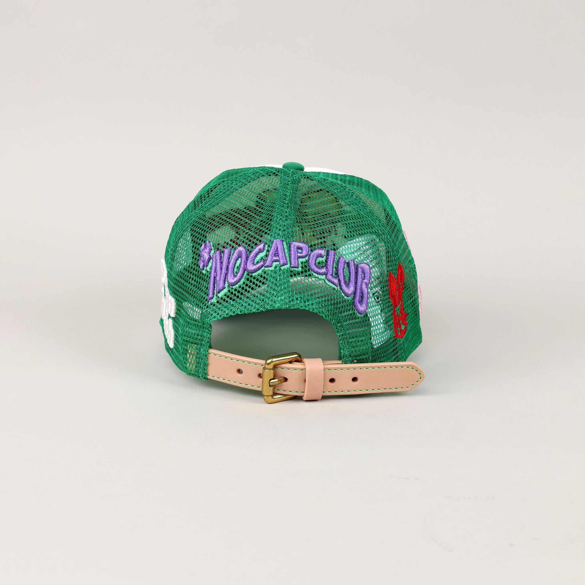 Green mesh cap with "NOCAPCLUB" text, adjustable strap.