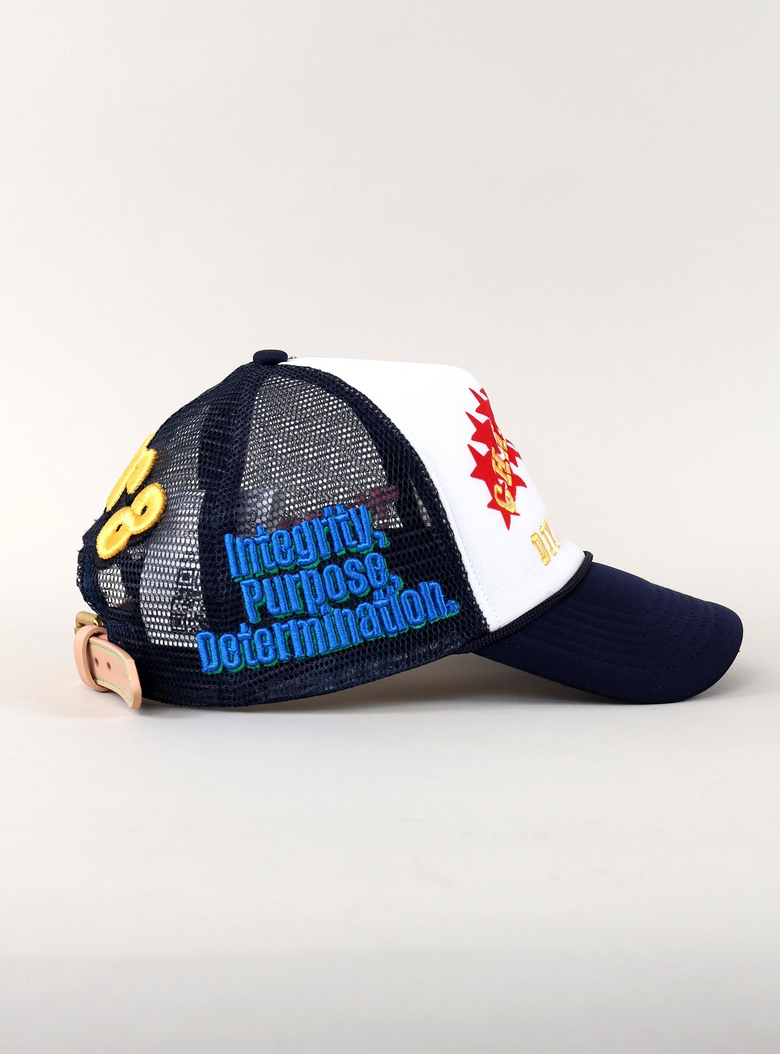 Blue and white cap with motivational text.