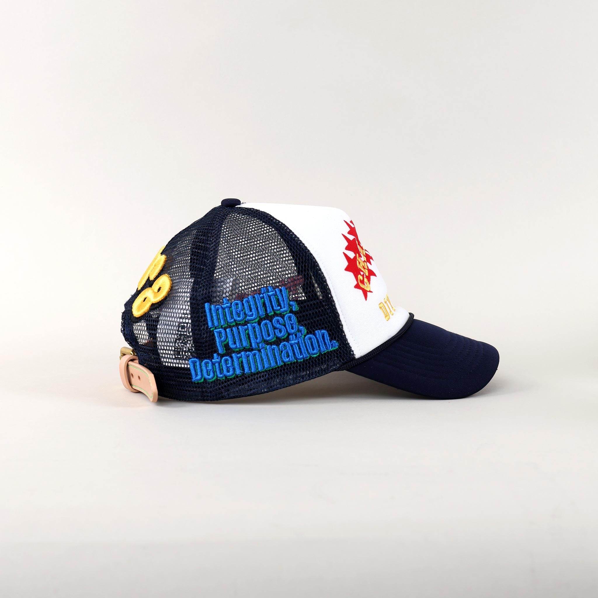 Blue and white cap with motivational text.