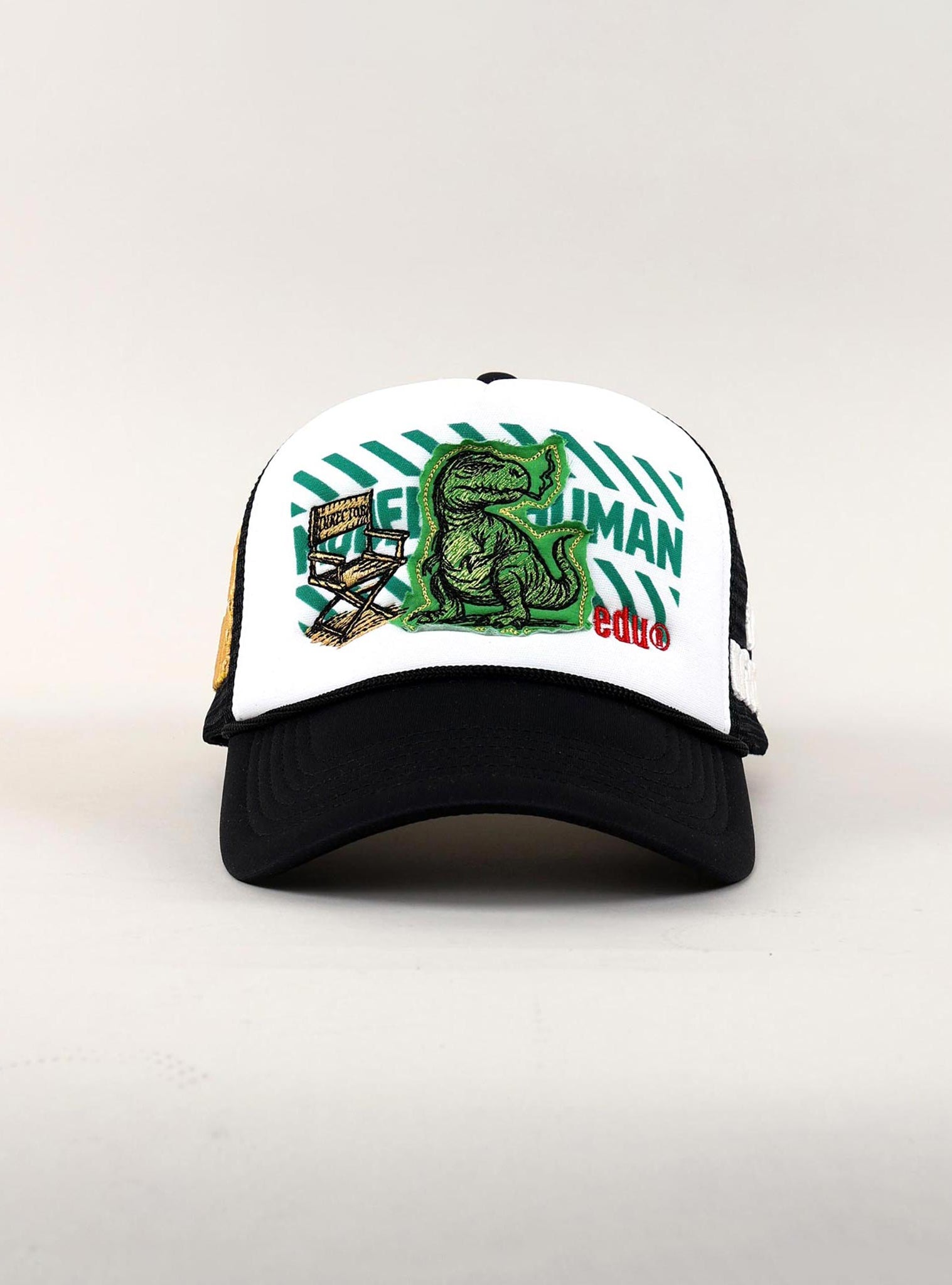Black and white cap with dinosaur and text design.