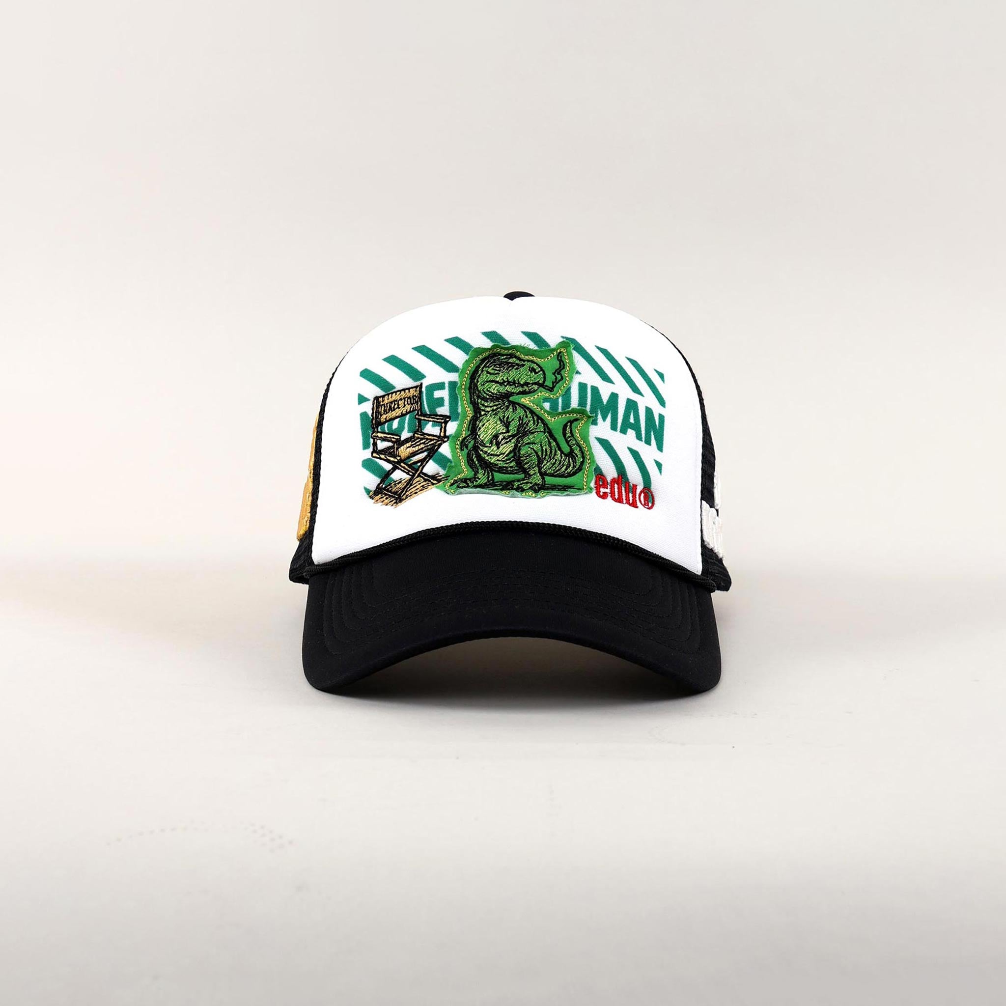 Black and white cap with dinosaur and text design.