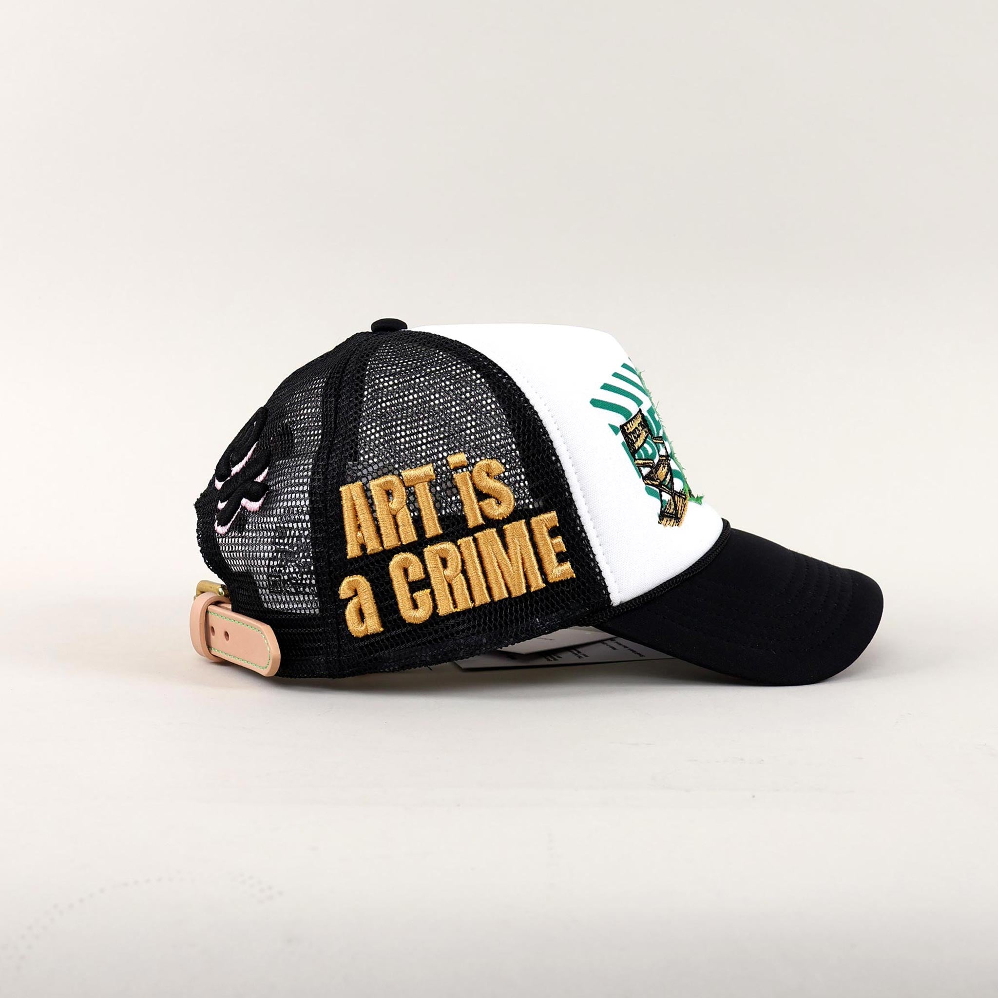Black and white cap with "Art is a Crime."