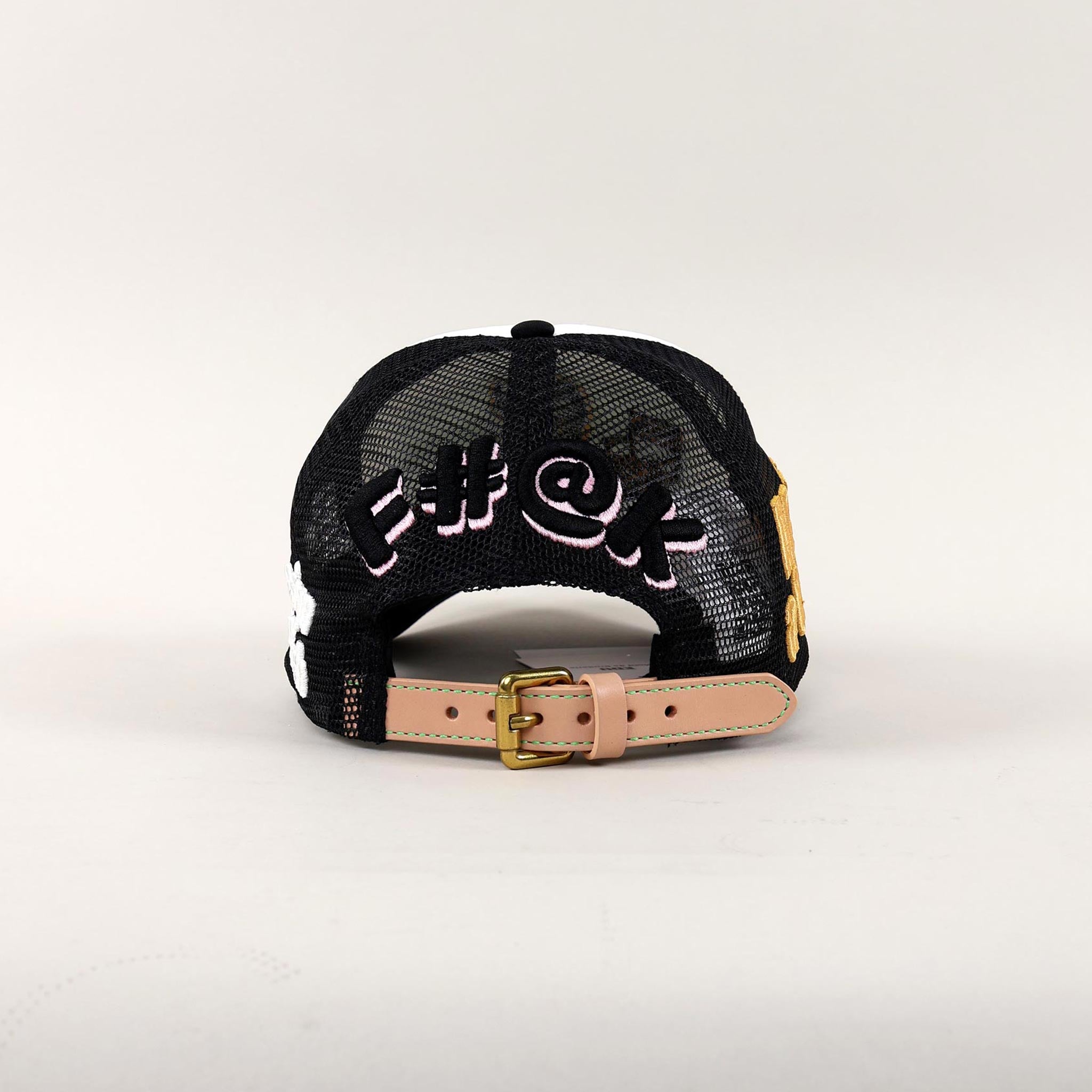 Back view of black mesh cap with embroidered text.