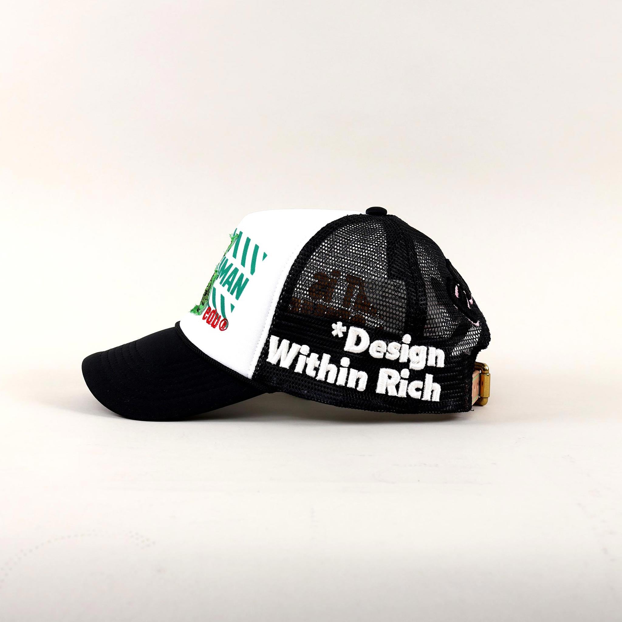 Black and white trucker hat with "Design Within Rich."