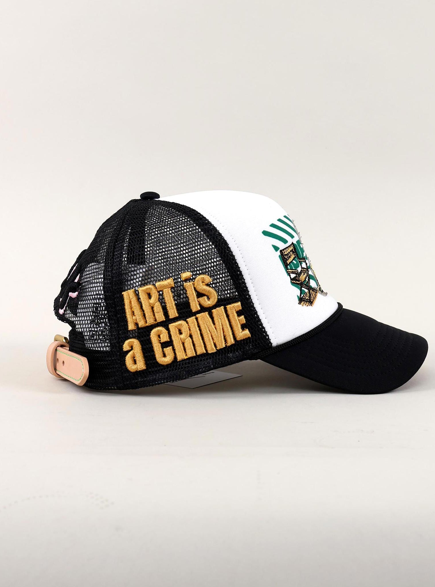 Black and white cap with "Art is a Crime."