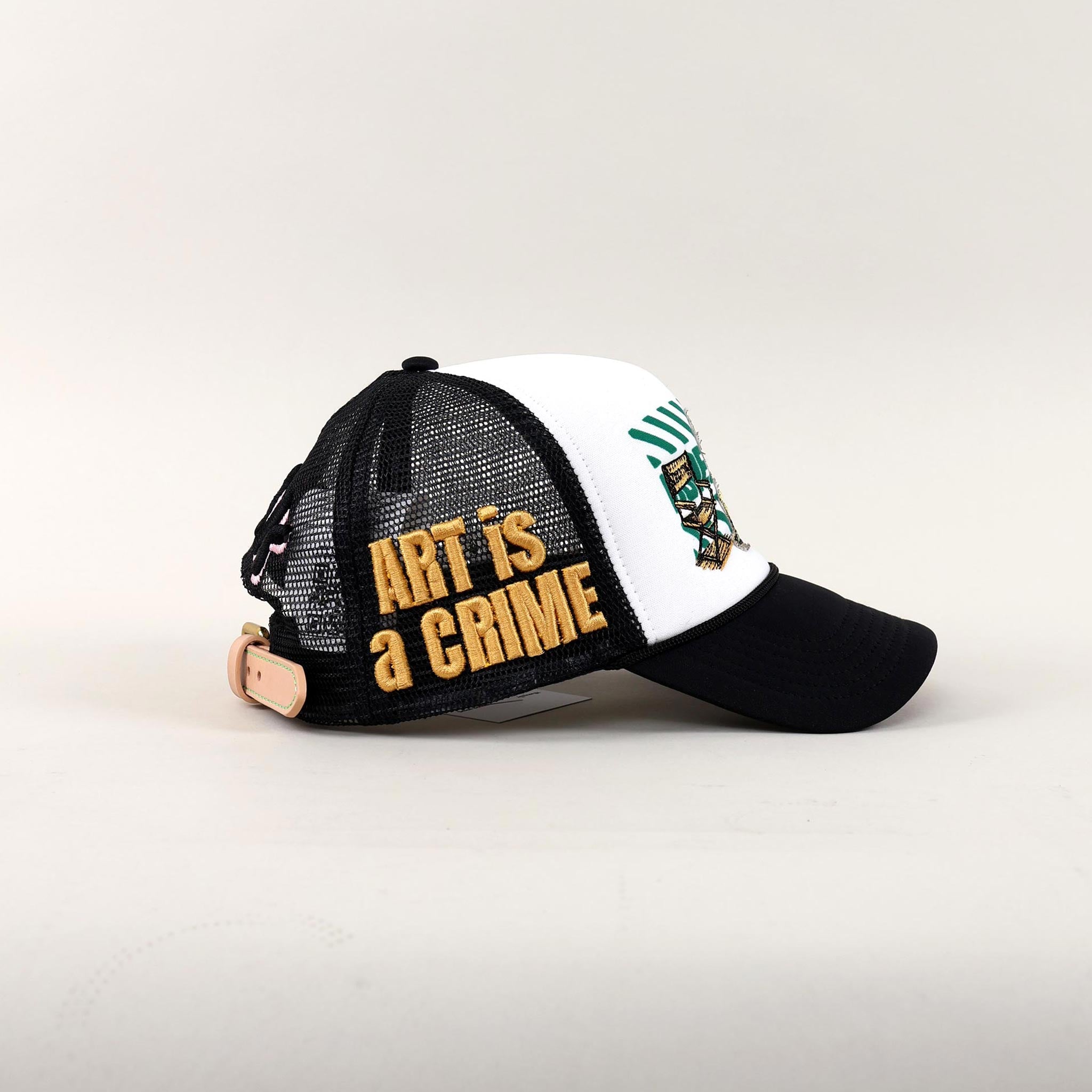 Black and white cap with "Art is a Crime."