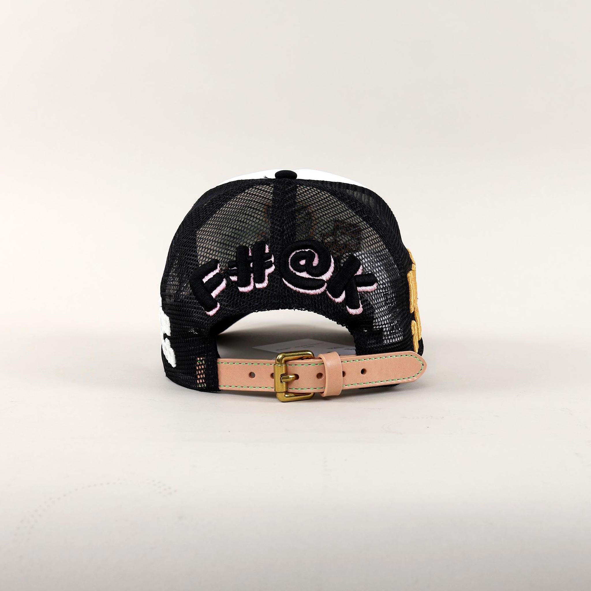 Back view of black mesh cap with embroidered text.