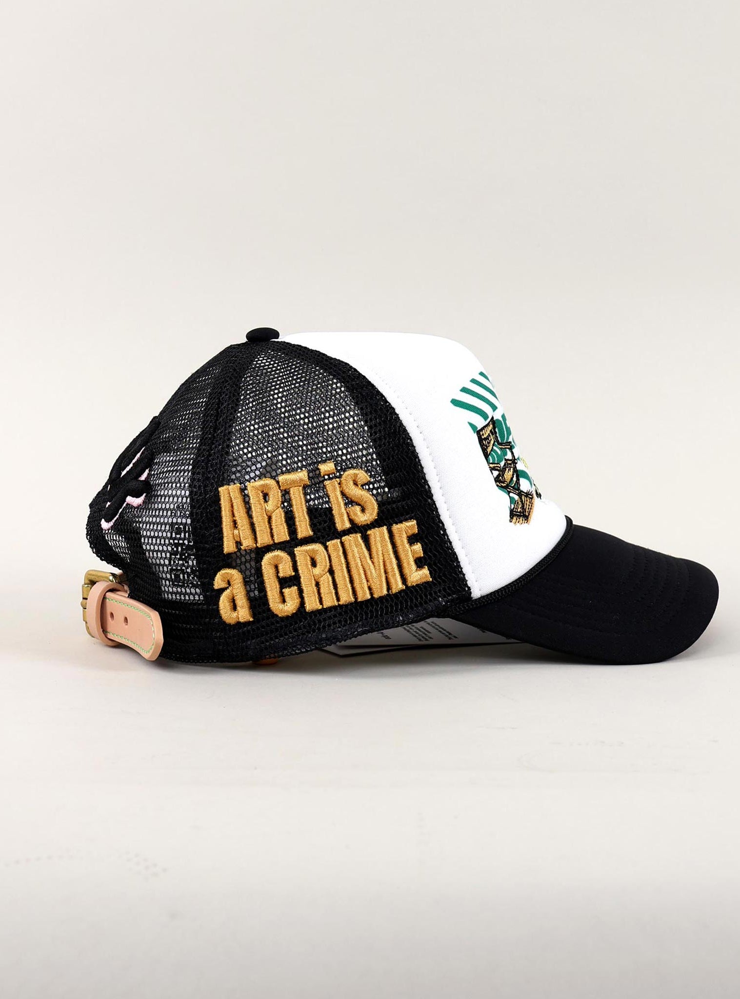 Black and white cap with "Art is a Crime."