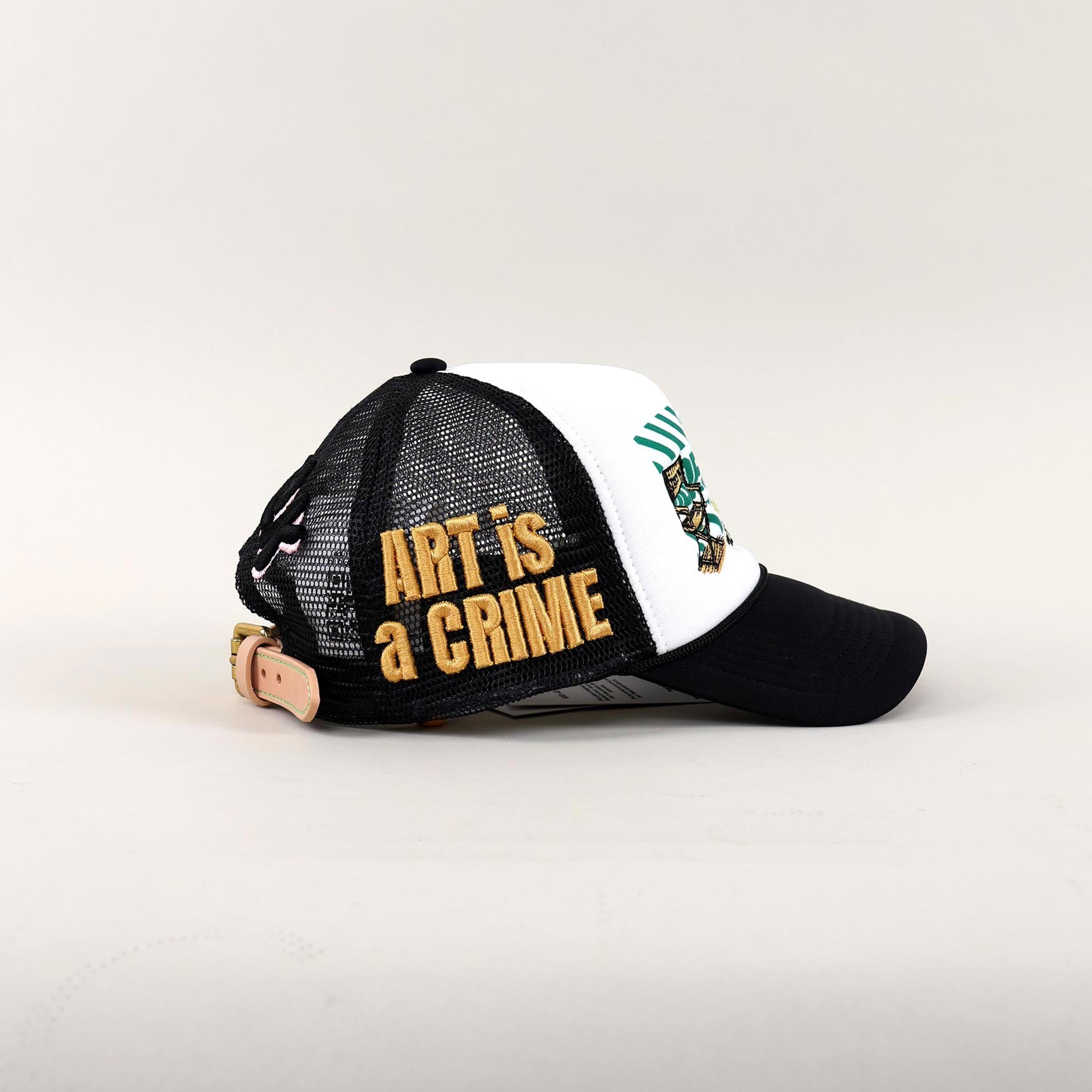 Black and white cap with "Art is a Crime."