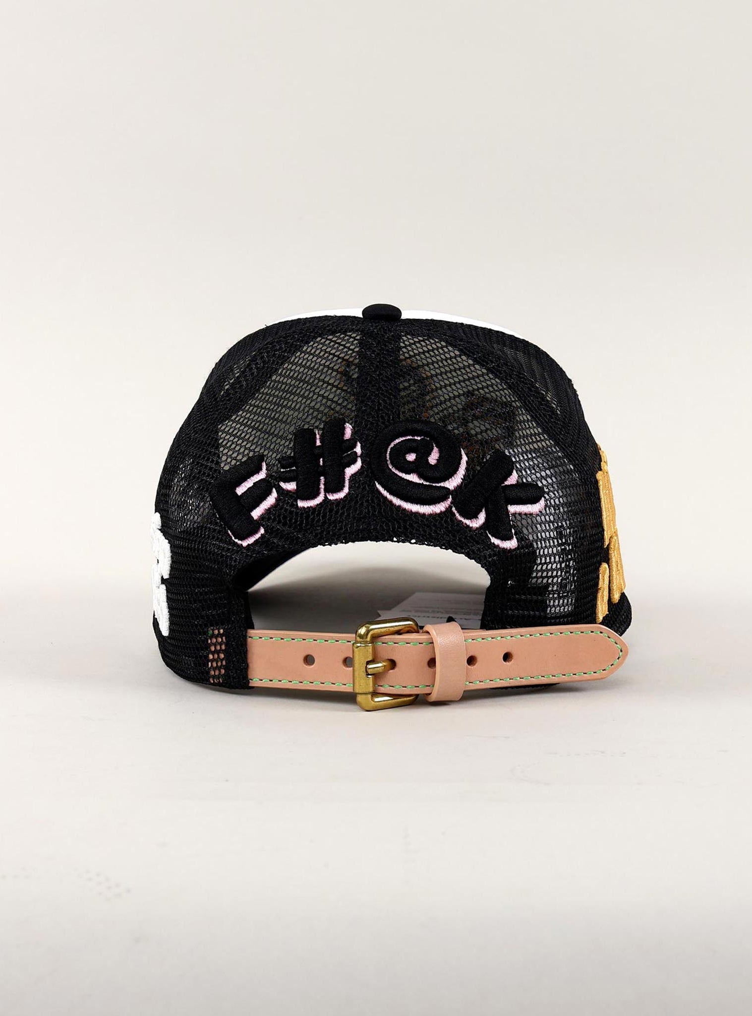 Black mesh cap with embroidered text and strap.