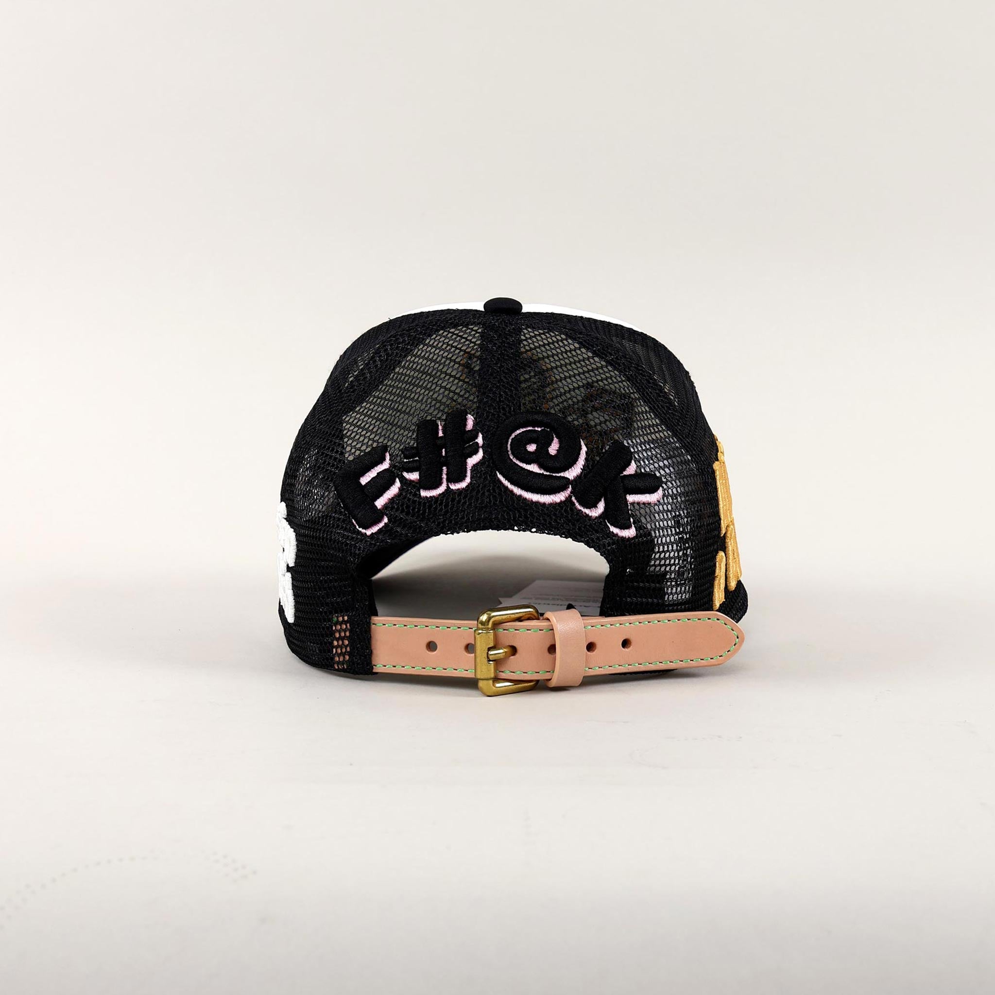 Black mesh cap with embroidered text and strap.