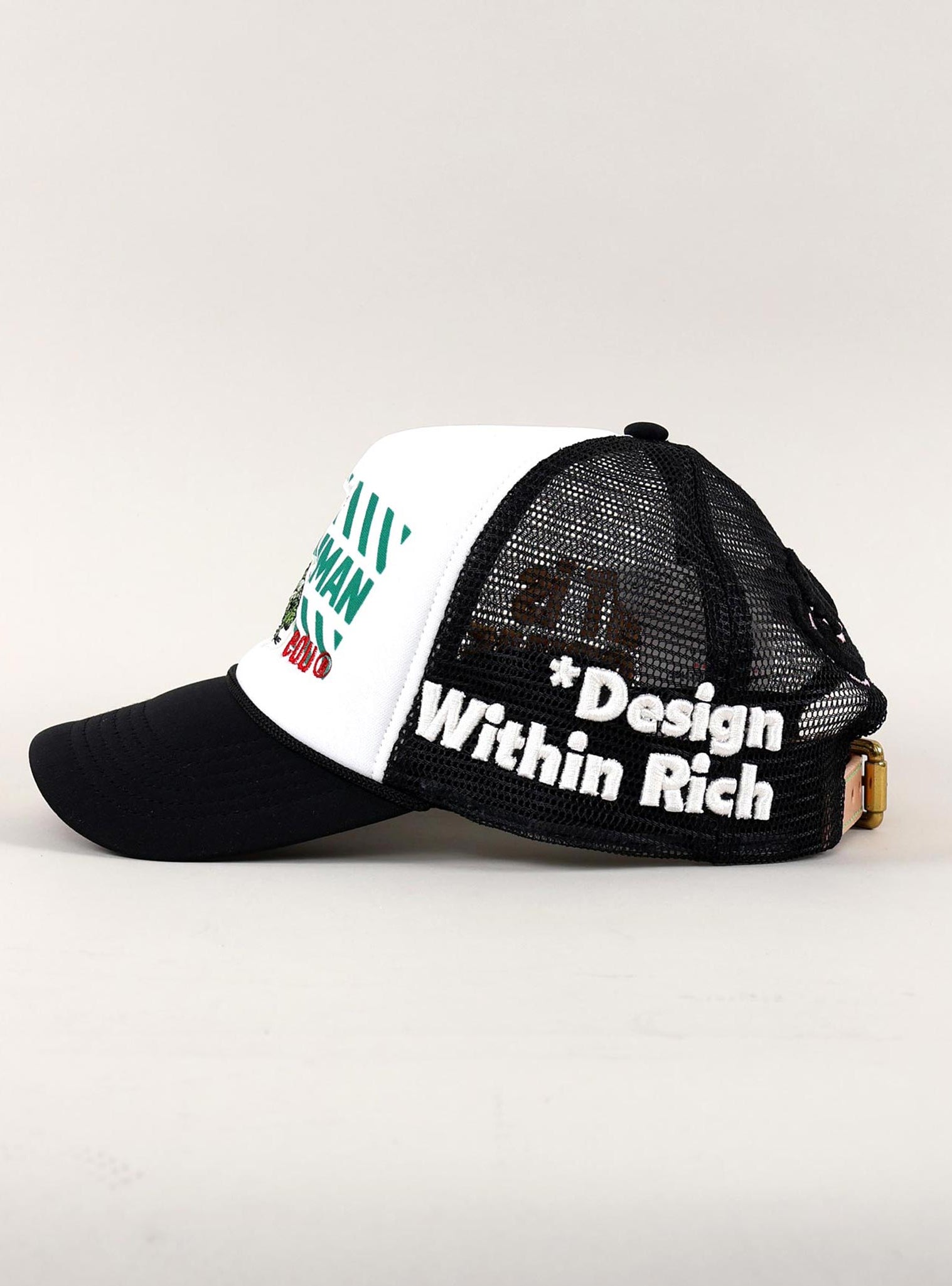 Black and white trucker hat with text on side.