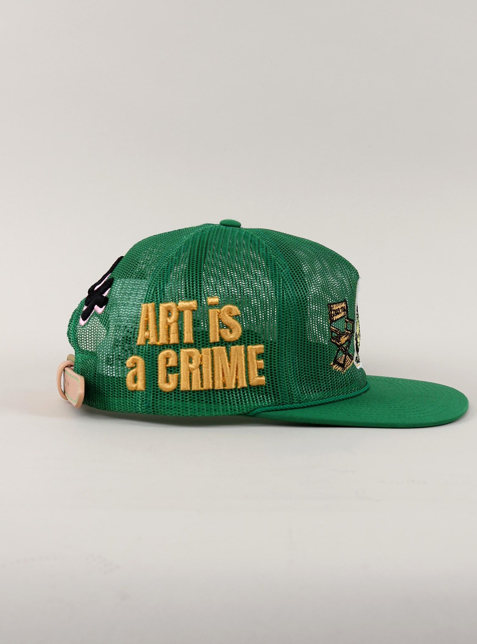 Black and white cap with "Art is a Crime."