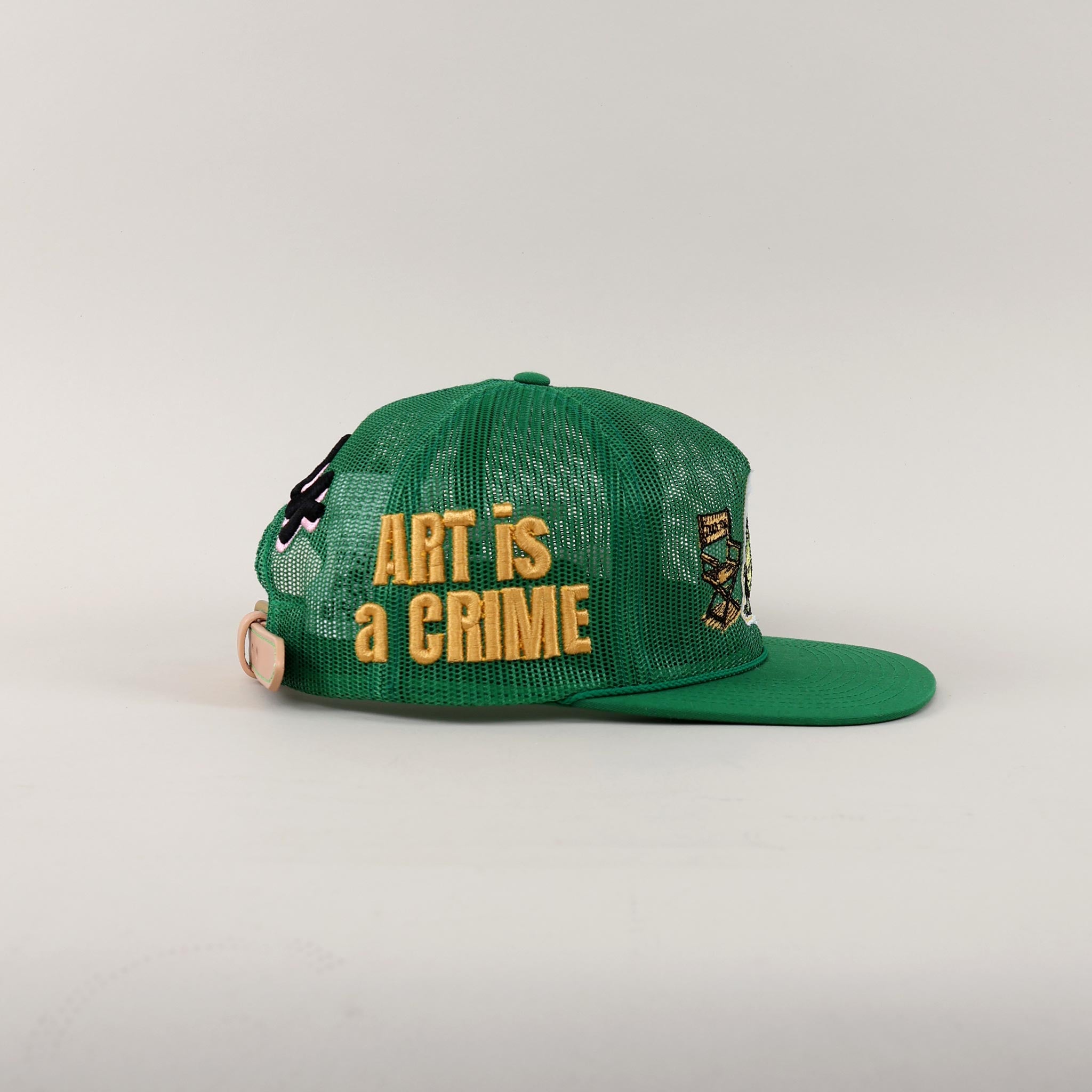 Black and white cap with "Art is a Crime."