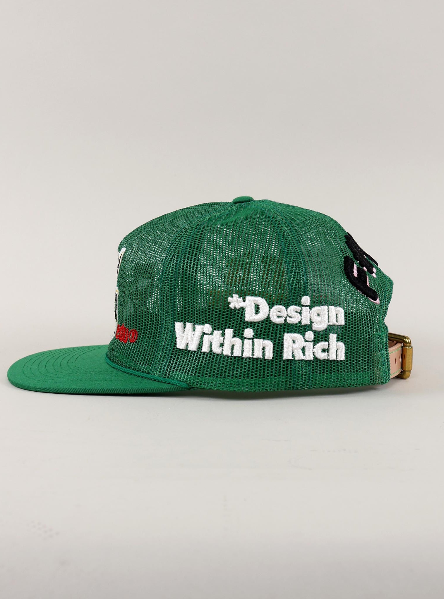 Black and white mesh cap with "Design Within Rich."