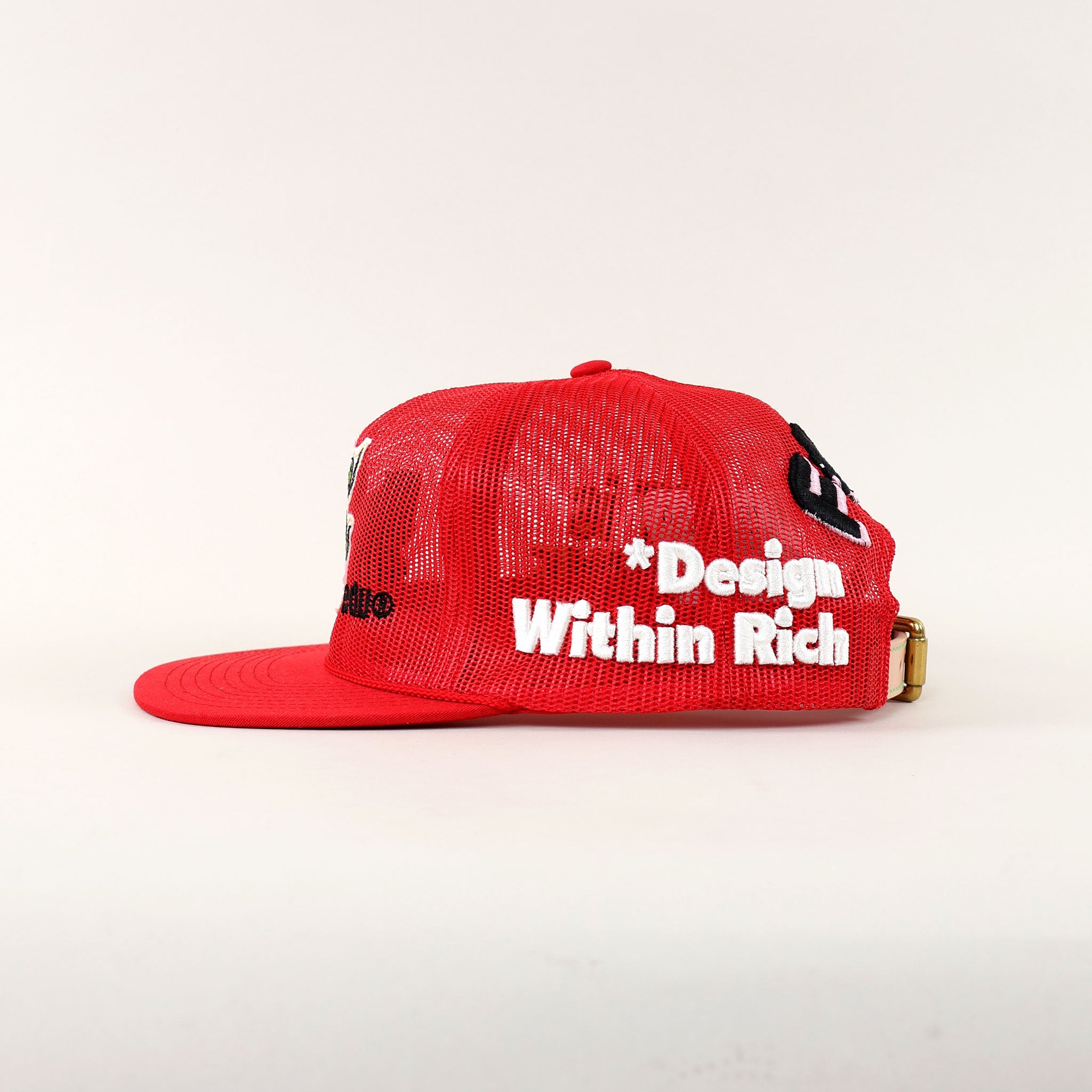 Red mesh cap with embroidered text.