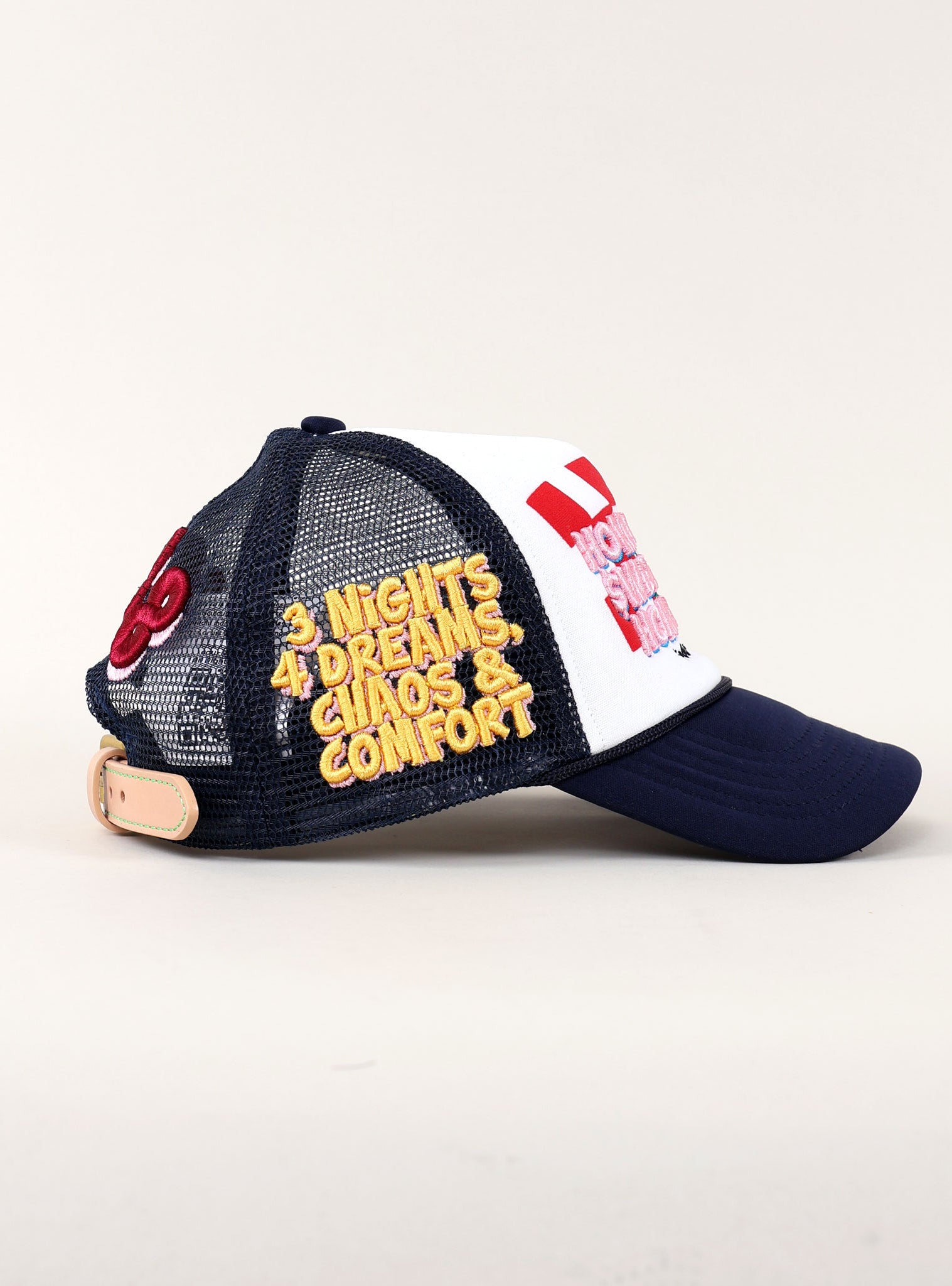 Navy and white cap with embroidered text.