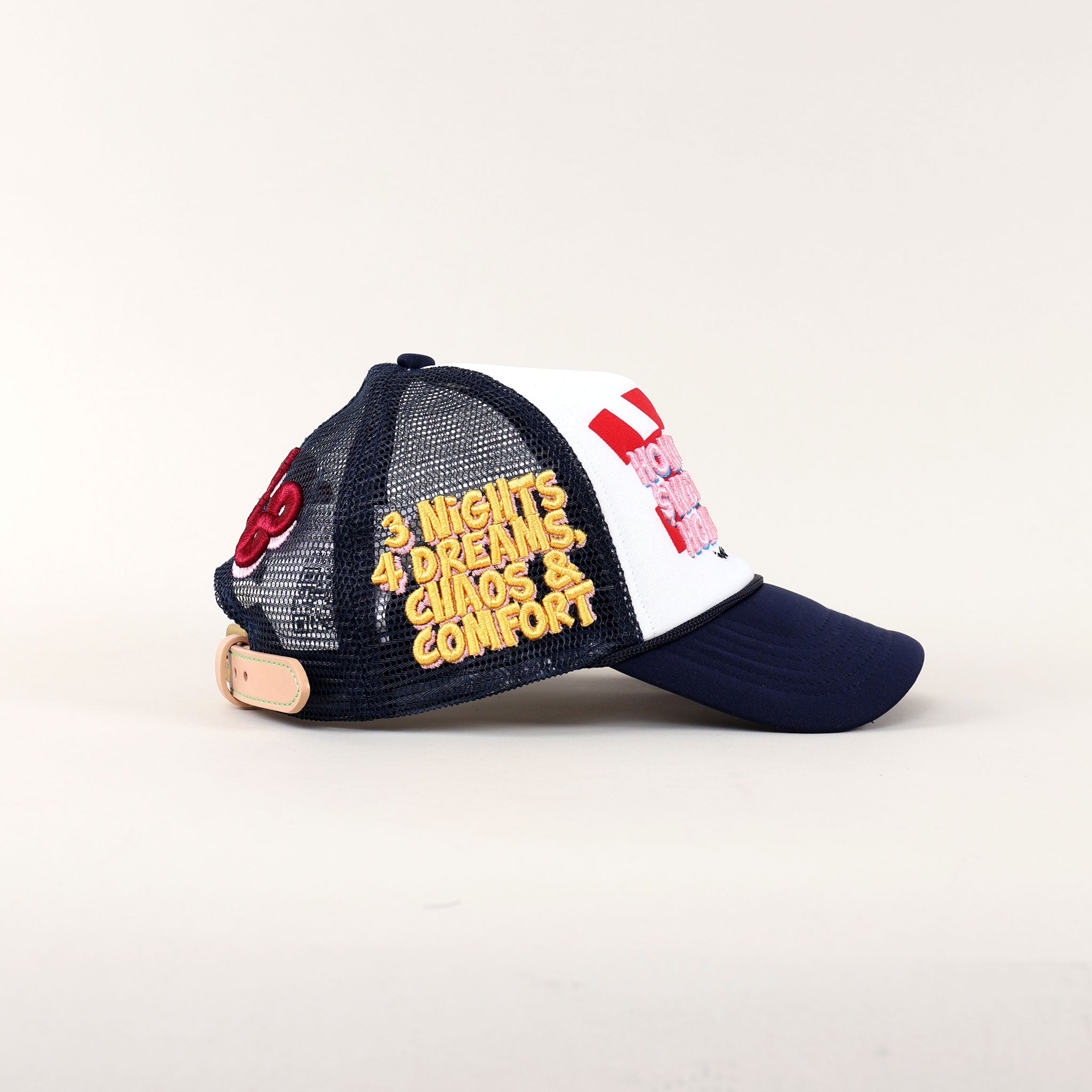 Navy and white cap with embroidered text.