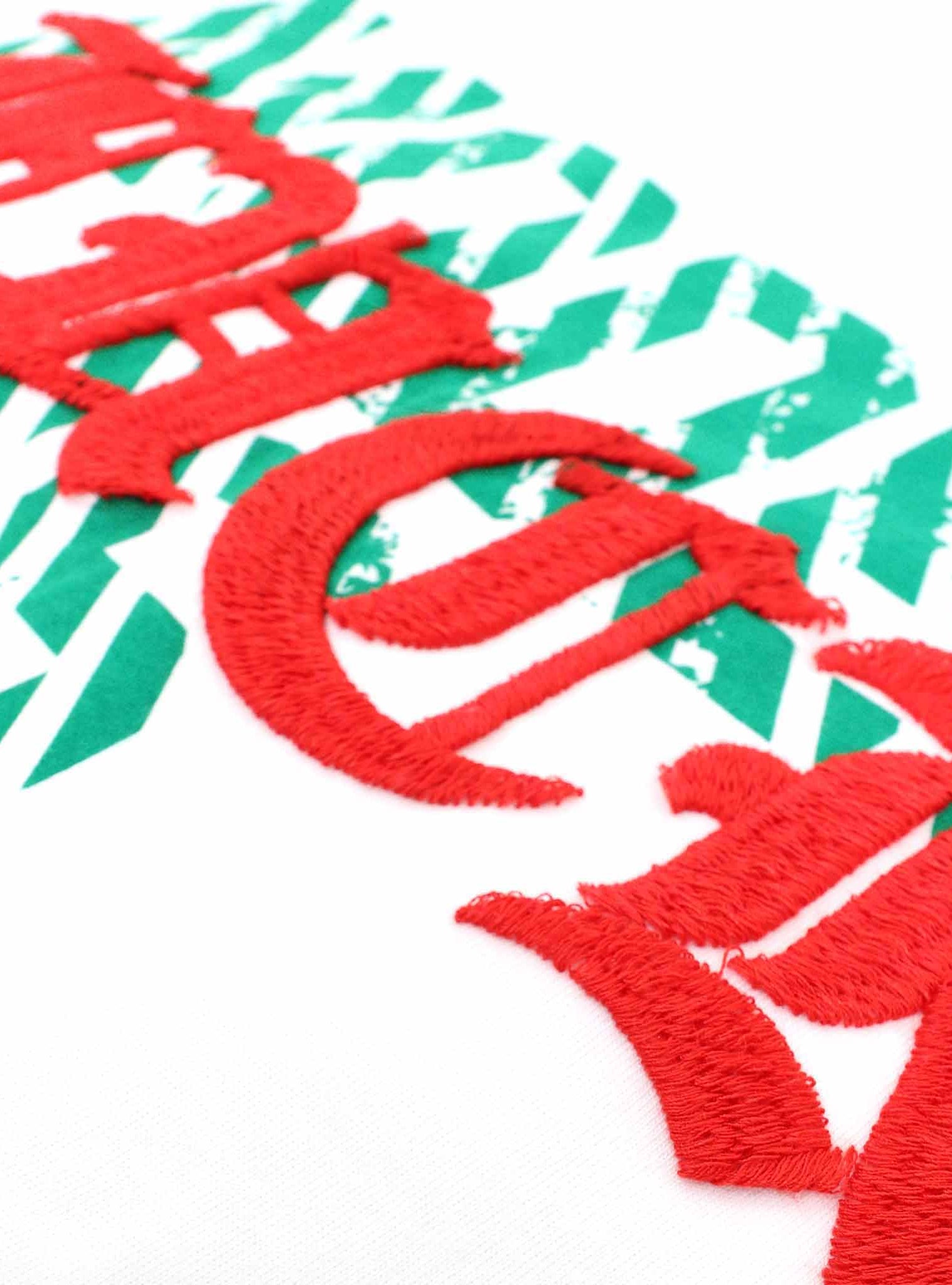 red and green art design on tee