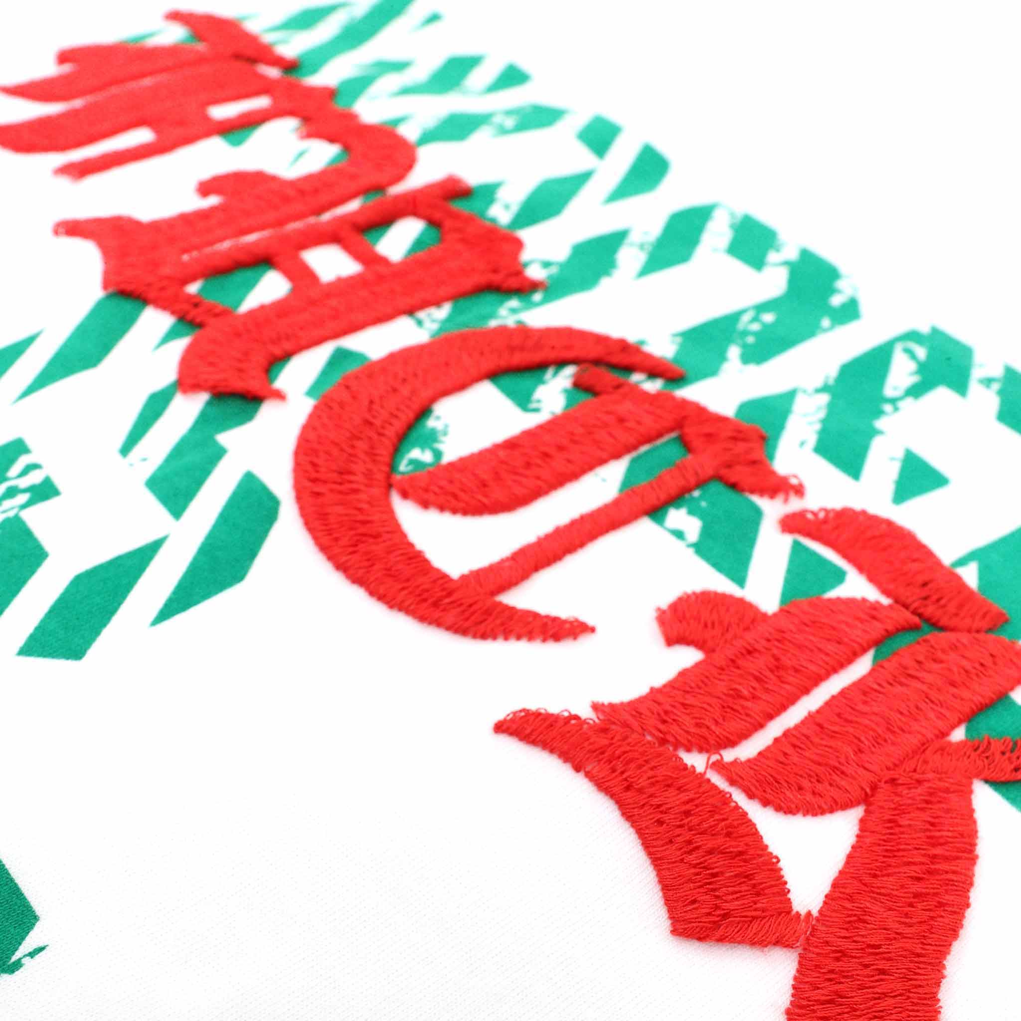 red and green art design on tee
