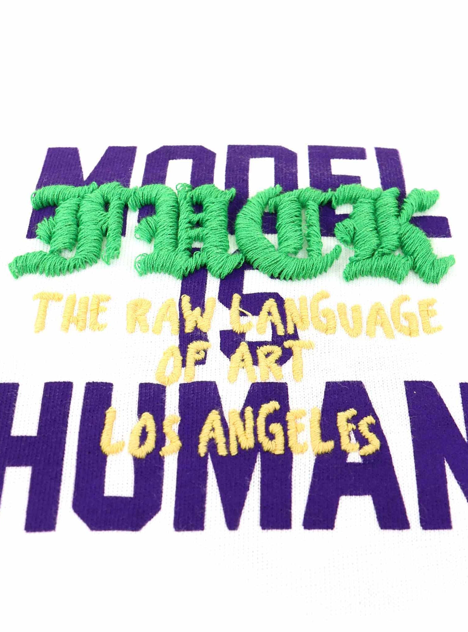 Text embroidery: "The Raw Language of Art Los Angeles".