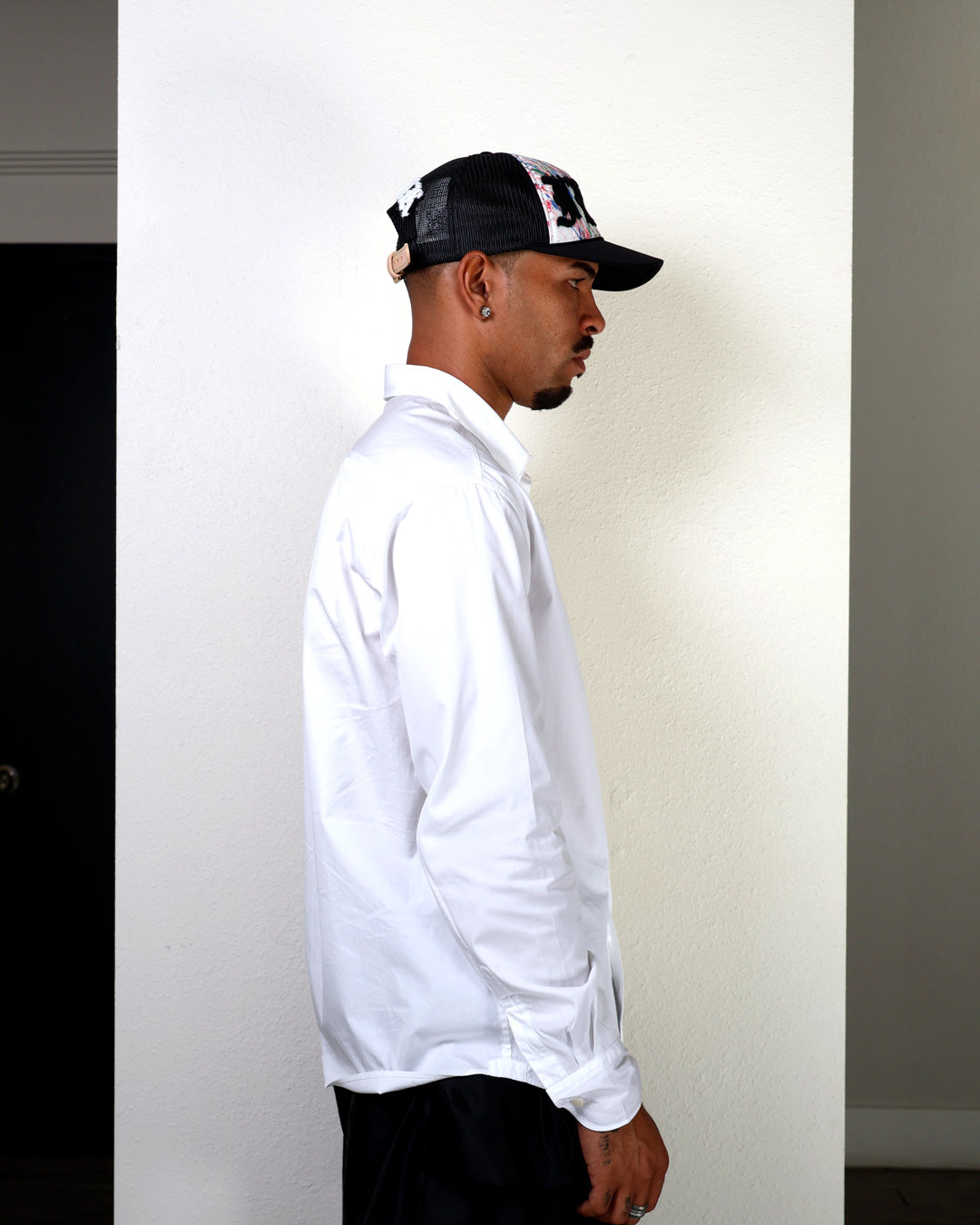 Person wearing black cap