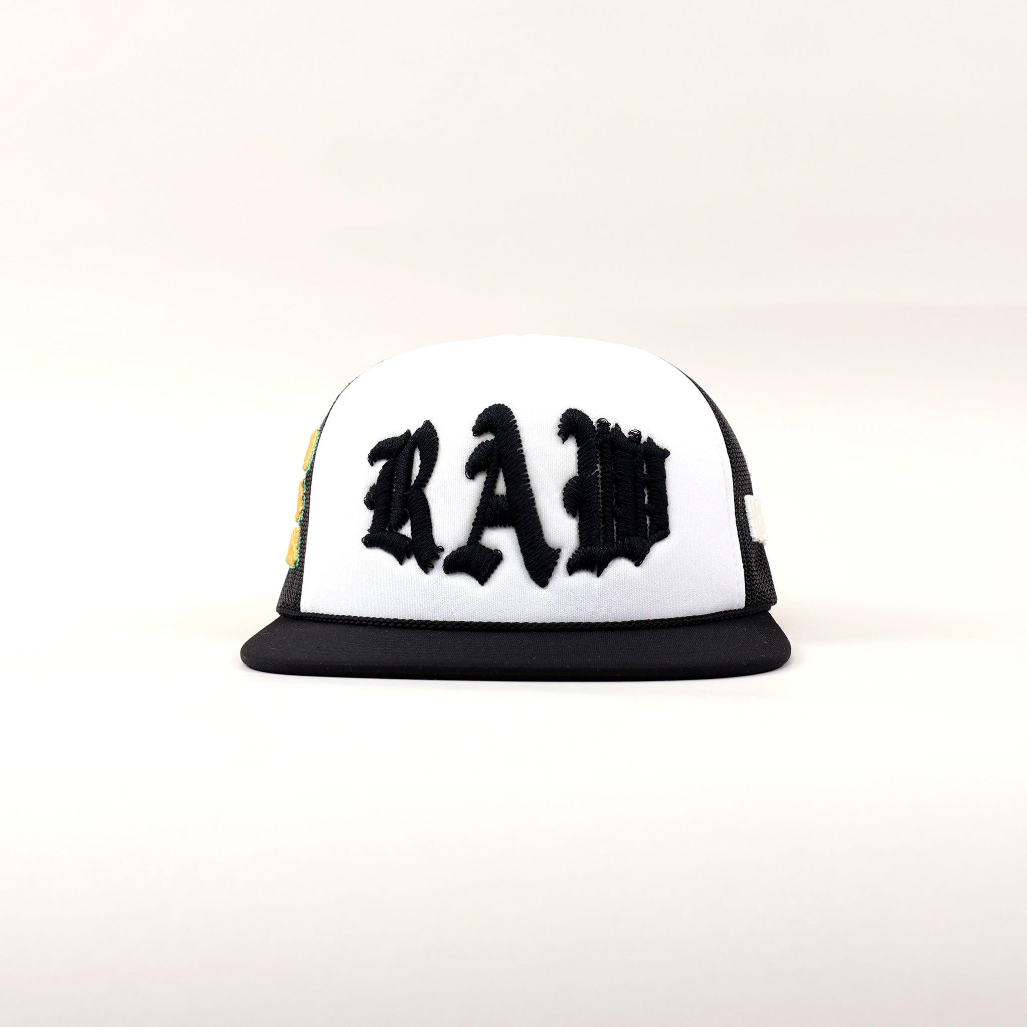 Black and white cap with "RAW" lettering.