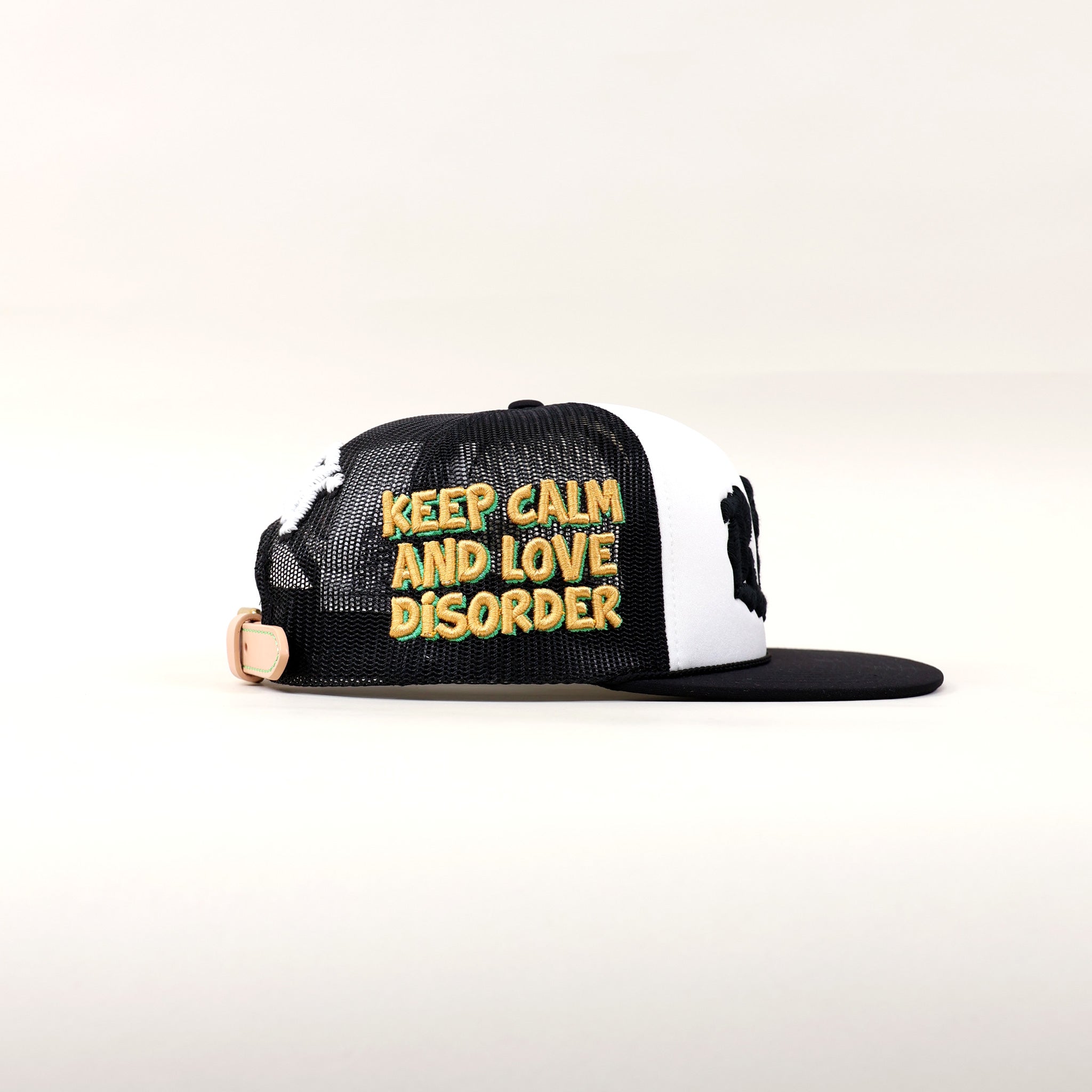 Black and white cap with text embroidery.