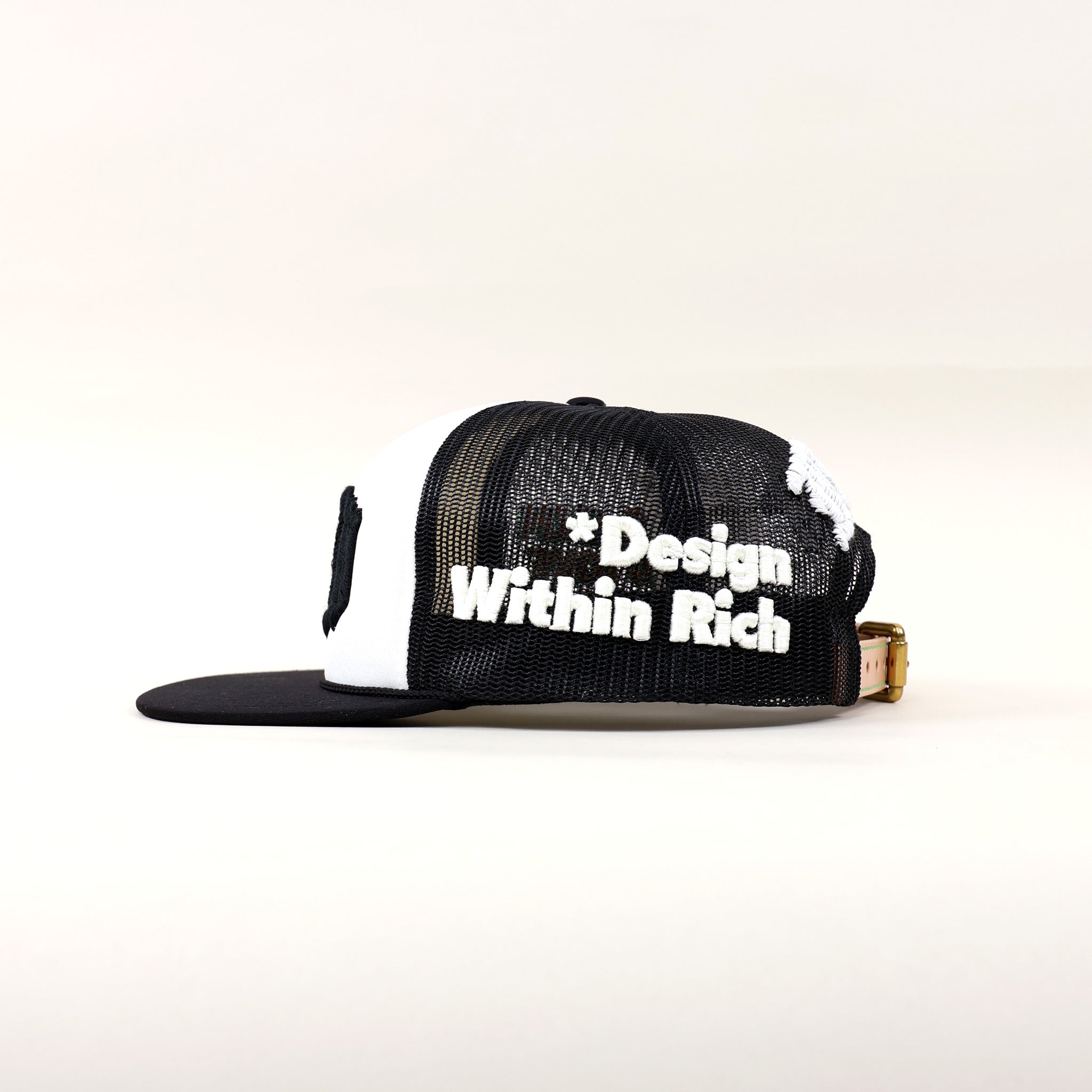 Black and white cap with text design.