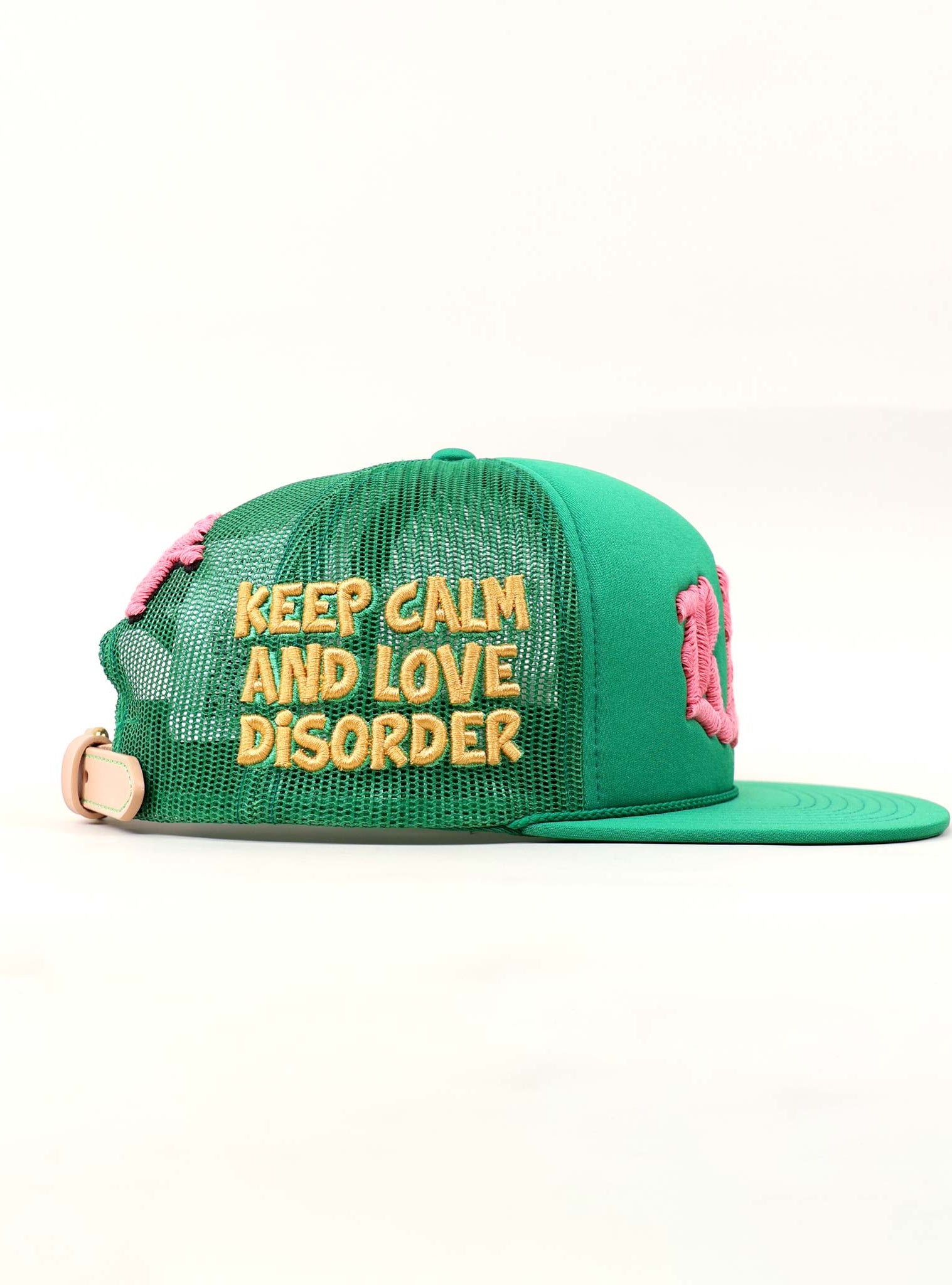 Green cap with "Keep Calm and Love Disorder" text.