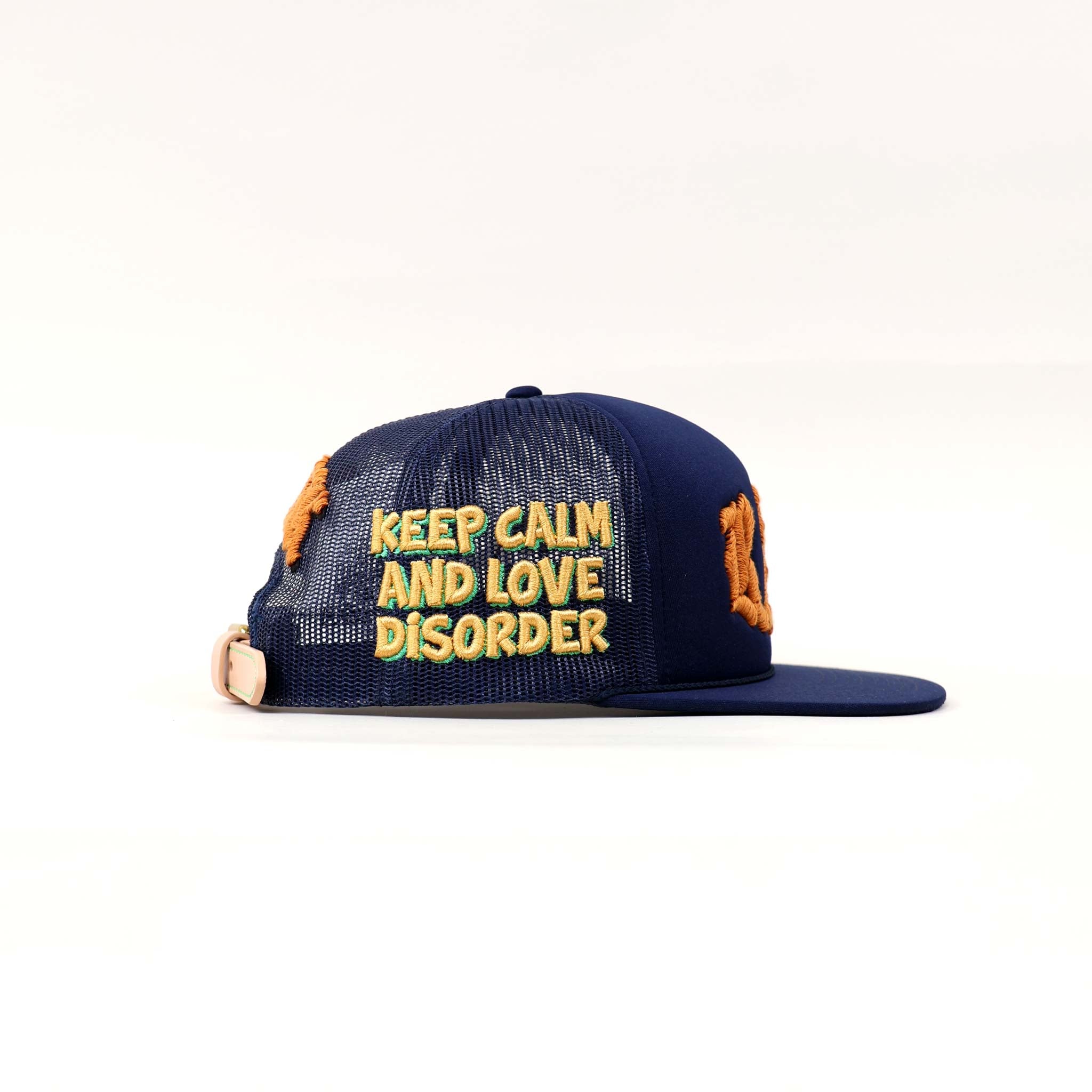 Blue cap with "Keep Calm and Love Disorder" text.
