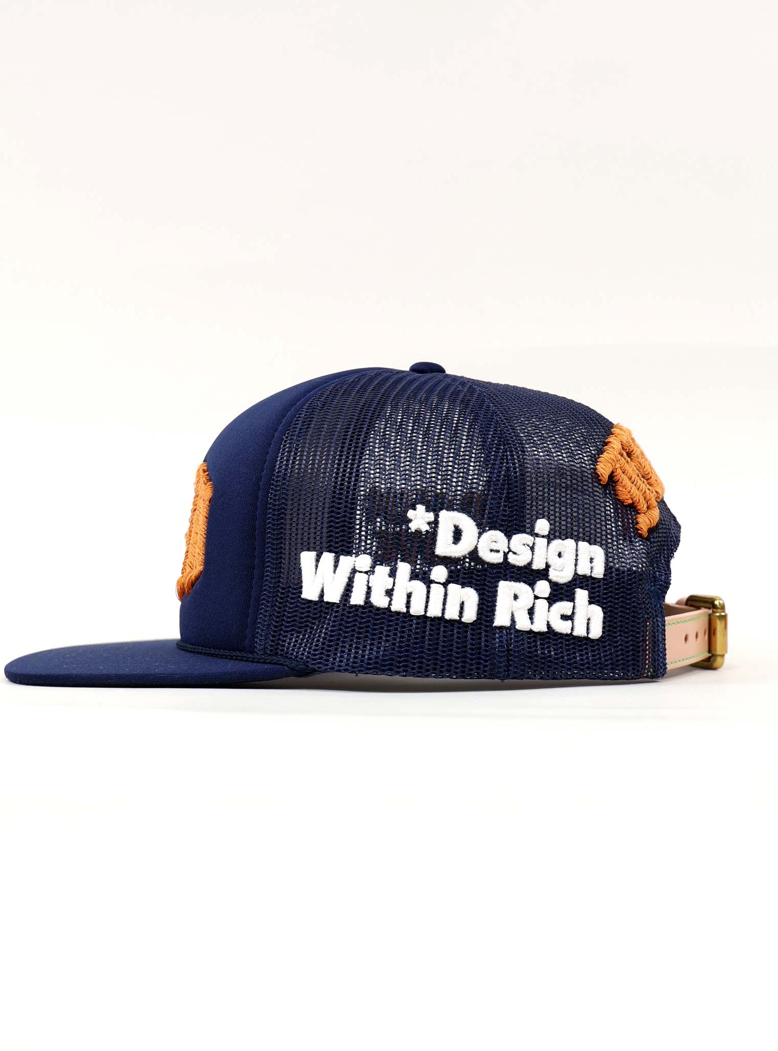 Blue mesh cap with "Design Within Rich" text.