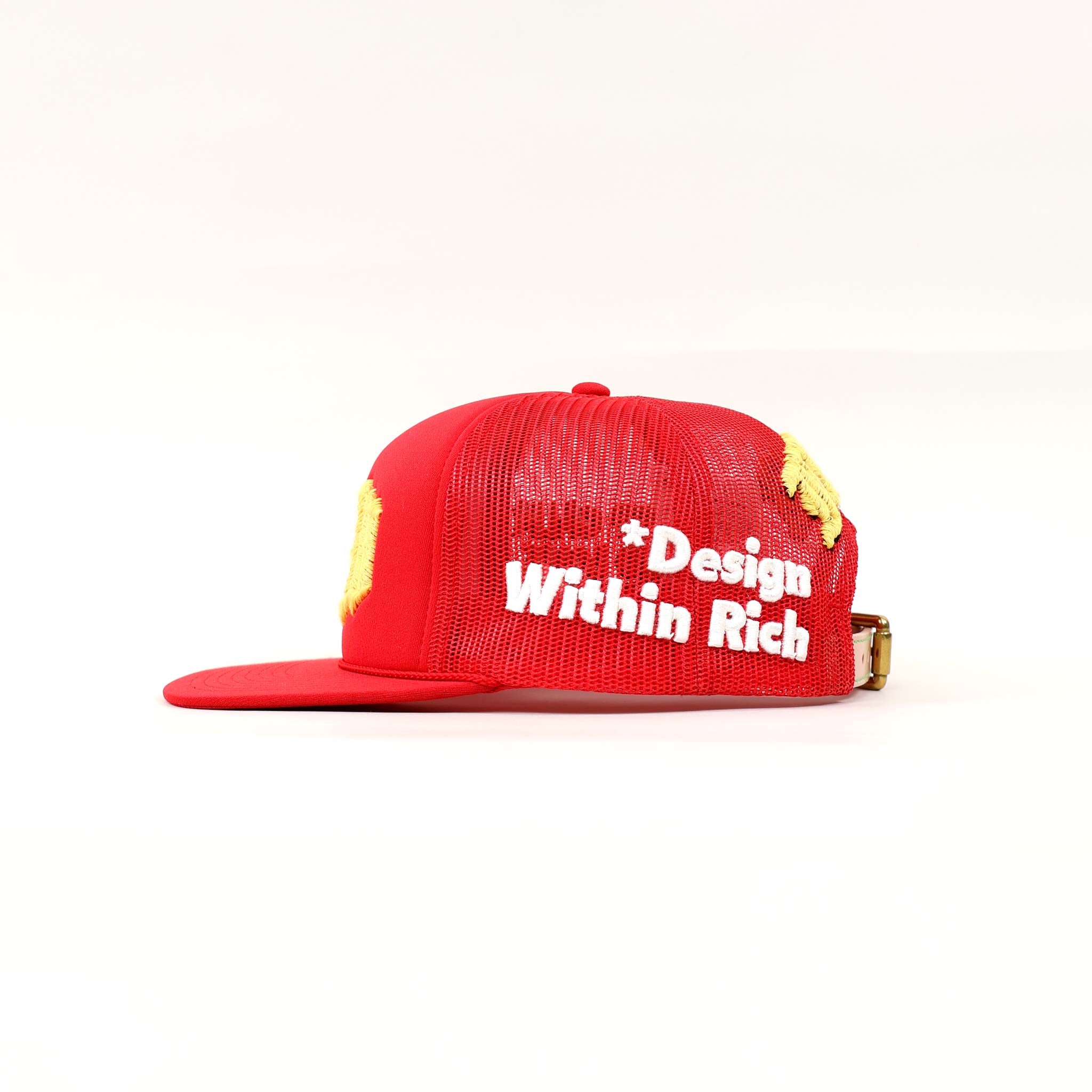 Red mesh cap with "Design Within Rich" text.