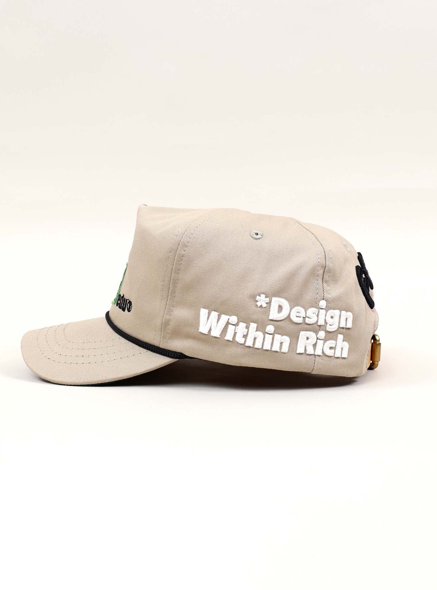 Beige cap with embroidered text.