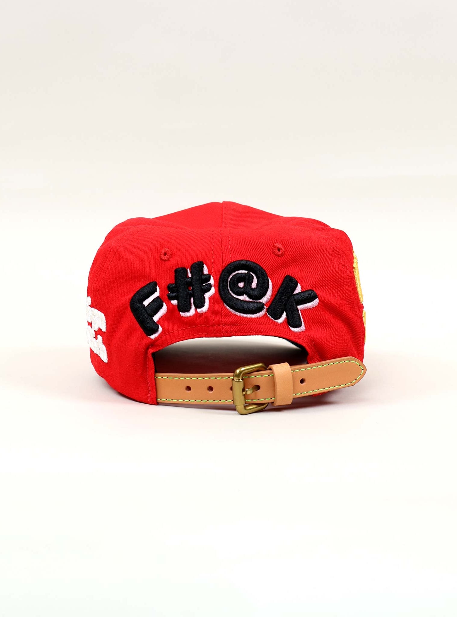 Red cap with embroidered text on the back.